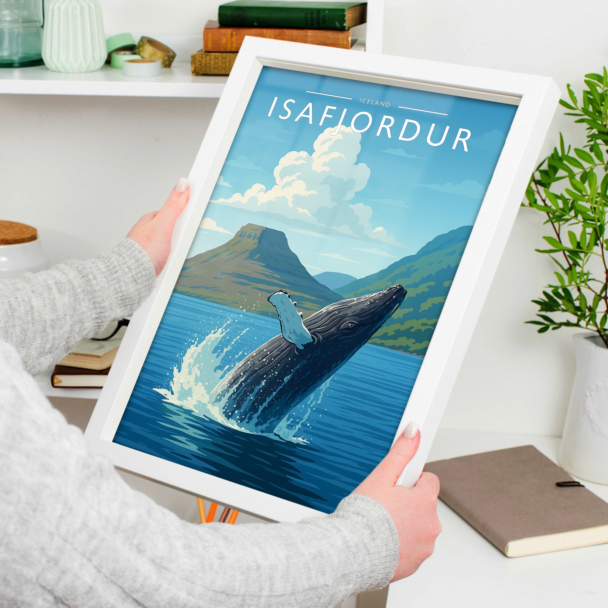 Isafjordur Travel Poster in a white frame, held to show scale
