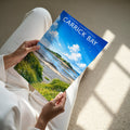 Carrick Bay Travel Poster - A4 print in hand