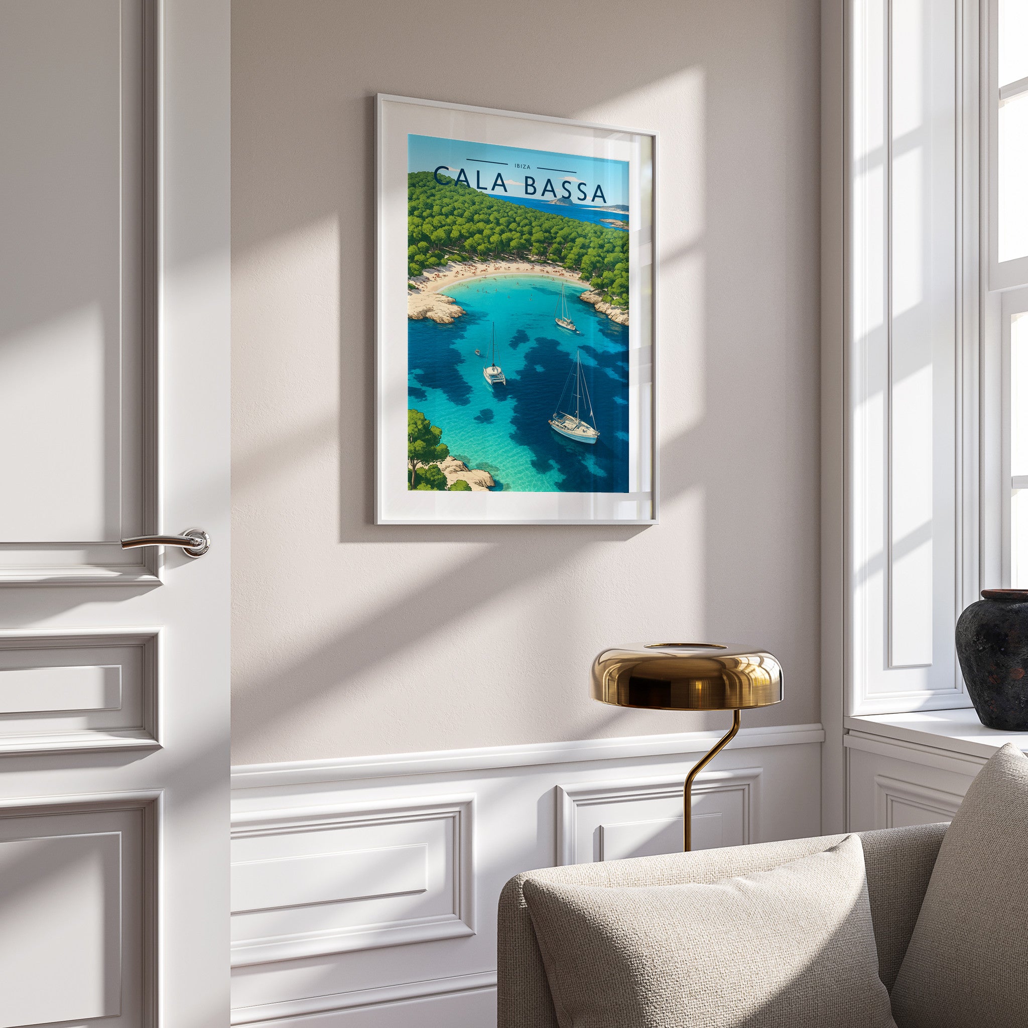 Cala Bassa Travel Poster in a white frame on a panelled wall