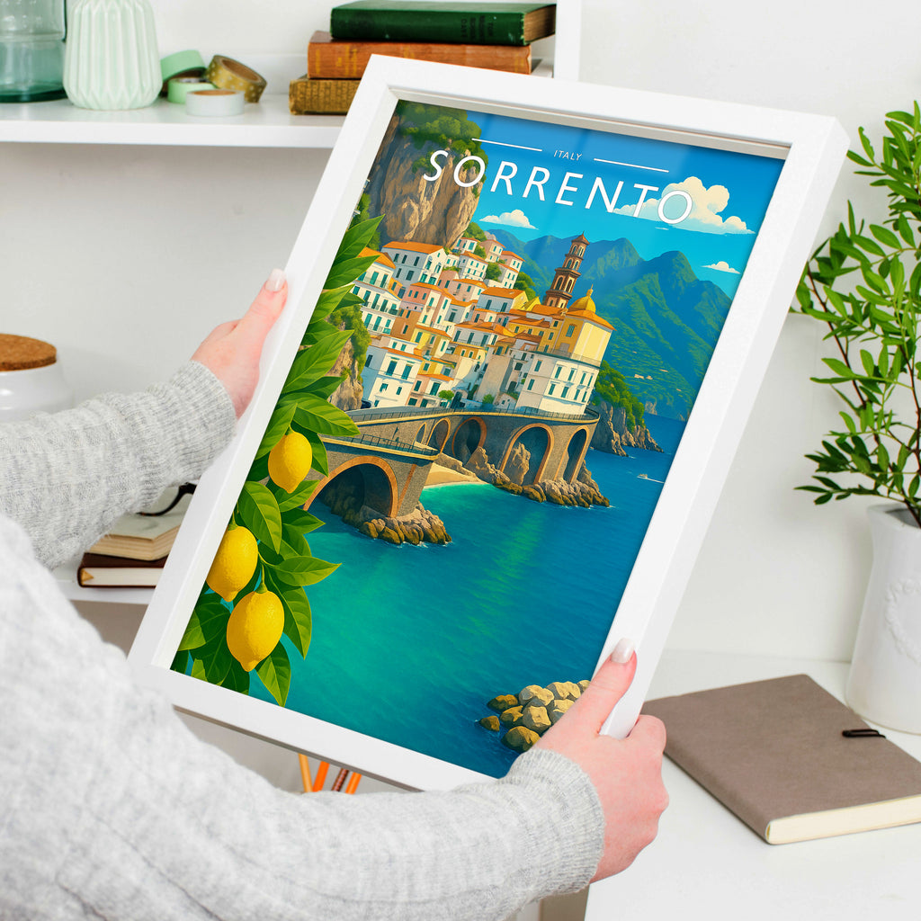 Sorrento Travel Poster in a white frame, held to show scale