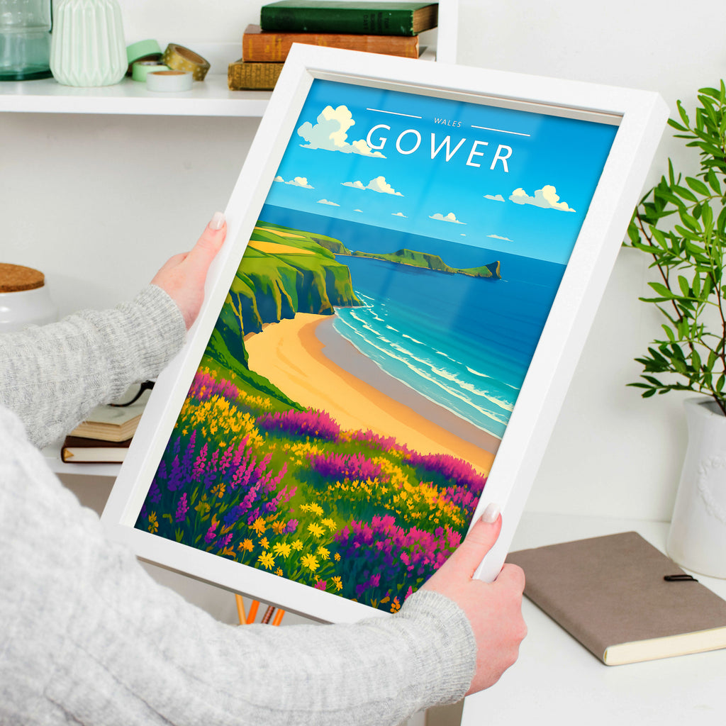 Gower Travel Poster in a white frame, held to show scale