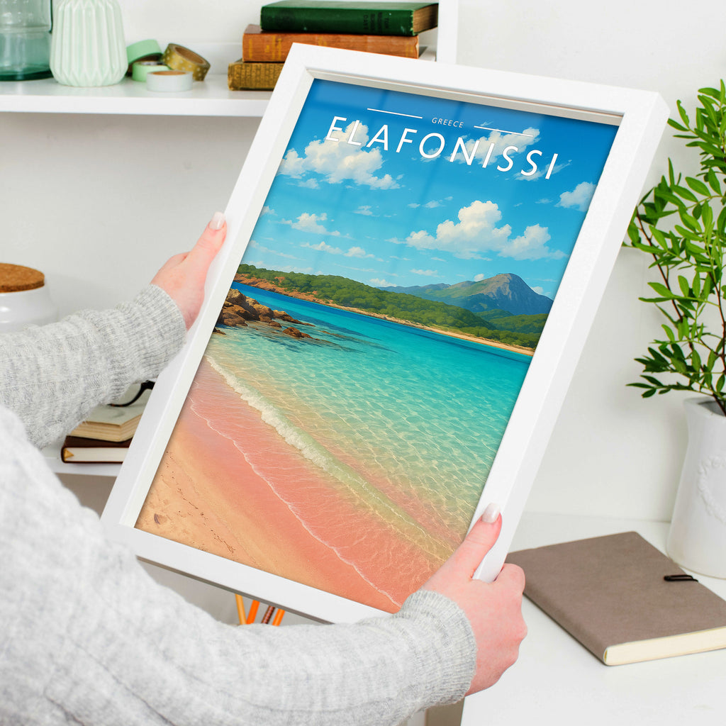 Elafonissi Travel Poster in a white frame, held to show scale