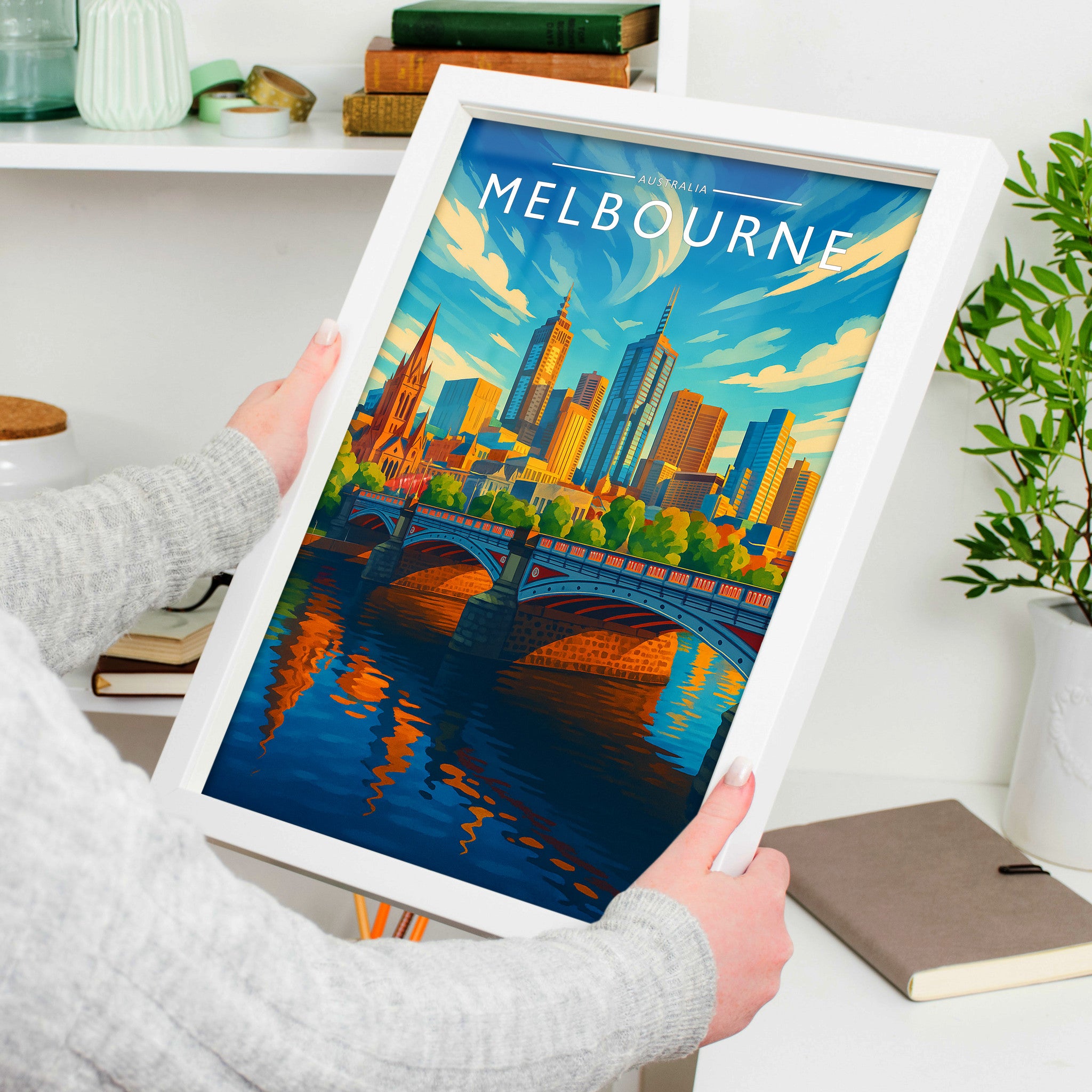 Melbourne Travel Poster in a white frame, held to show scale