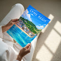 Lyme Regis Travel Poster - A4 print held in hand