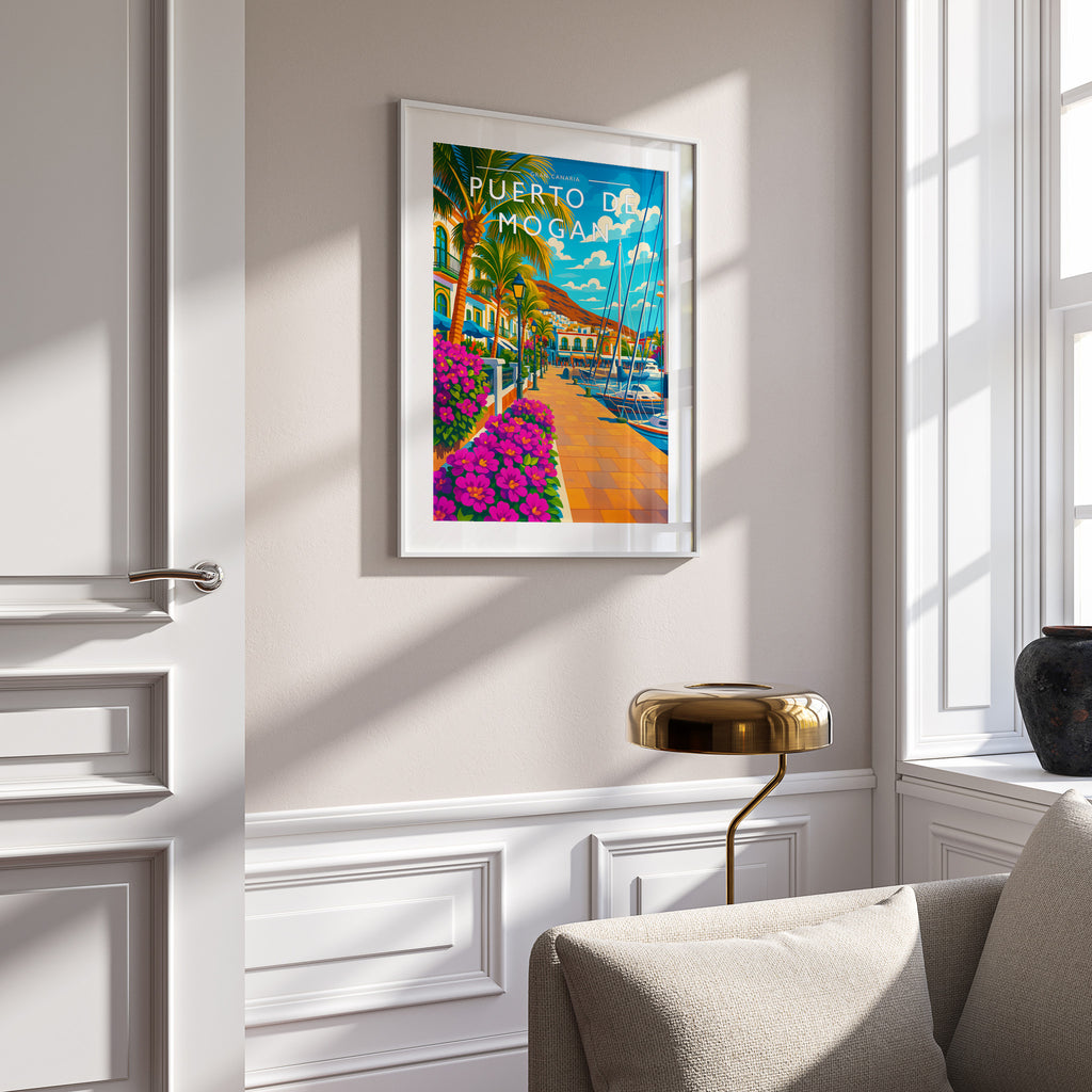 Puerto de Mogan Travel Poster in a white frame on a panelled wall