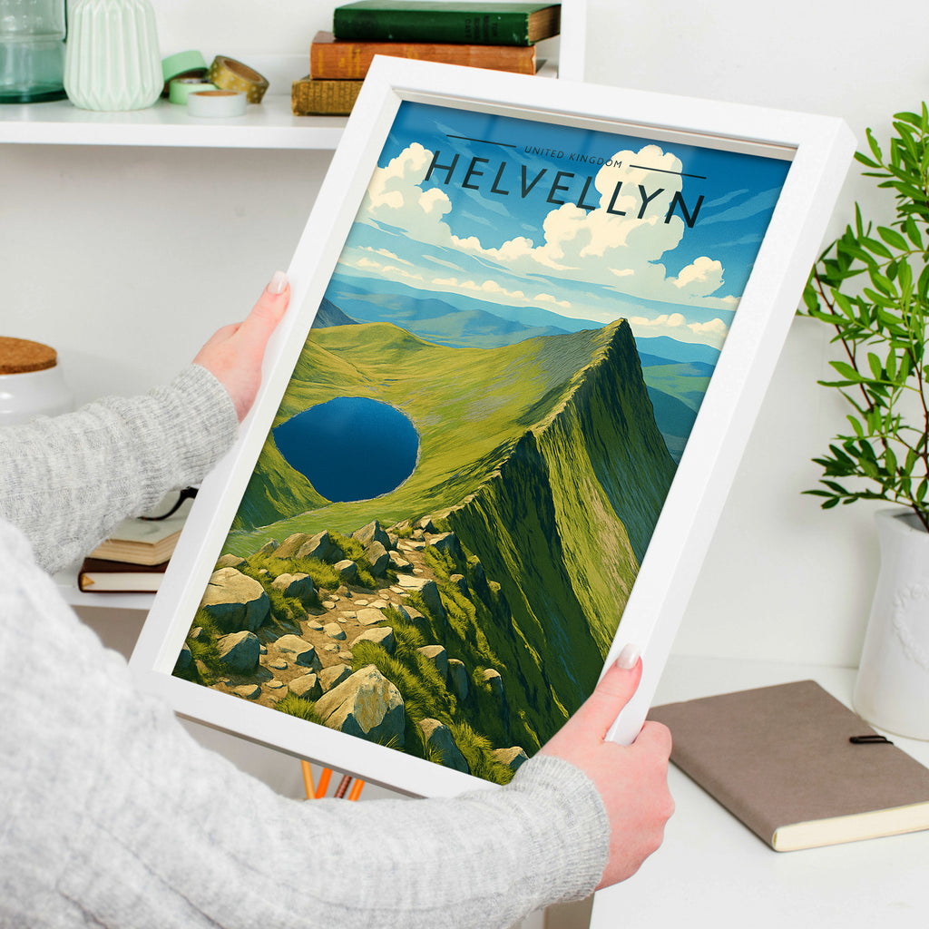 Helvellyn Travel Poster in a white frame, held to show scale
