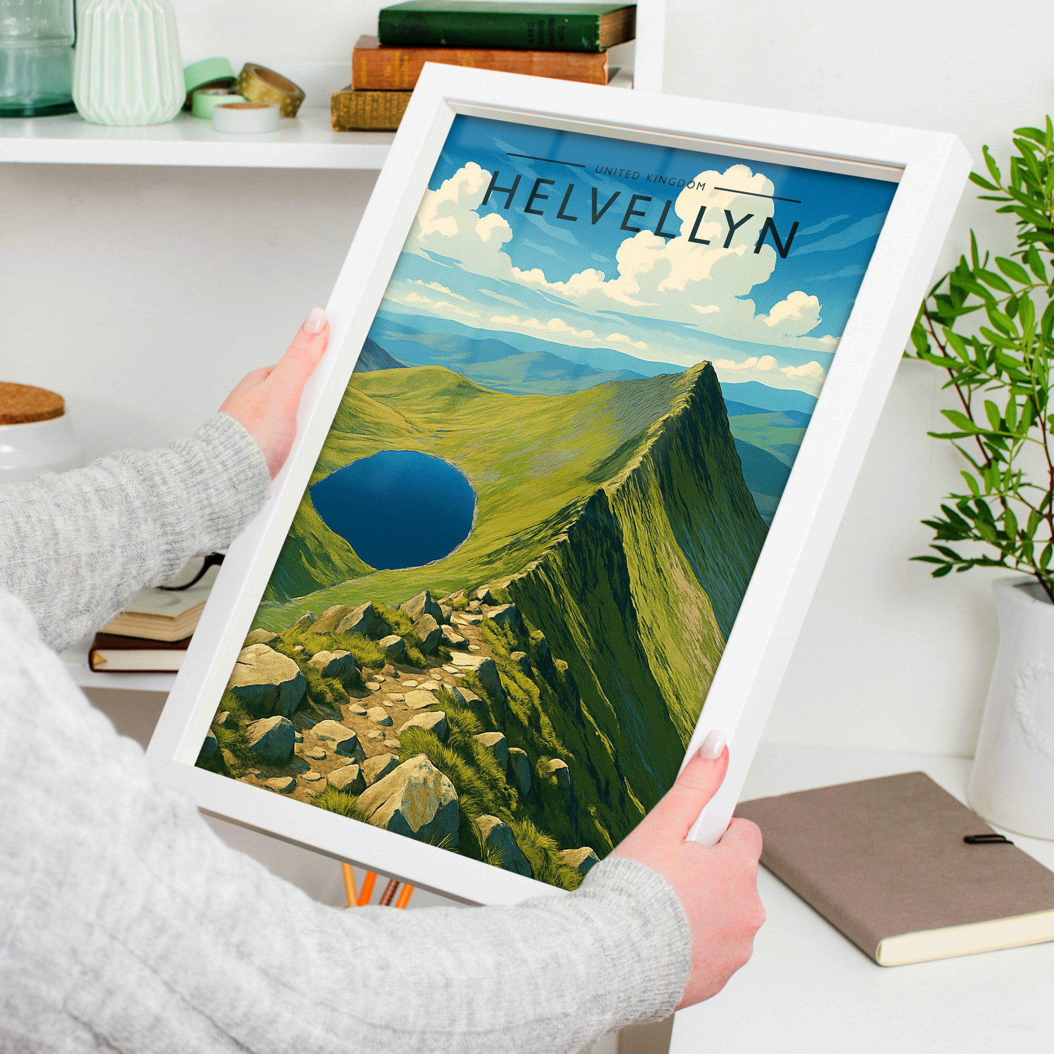 Helvellyn Travel Poster in a white frame, held to show scale