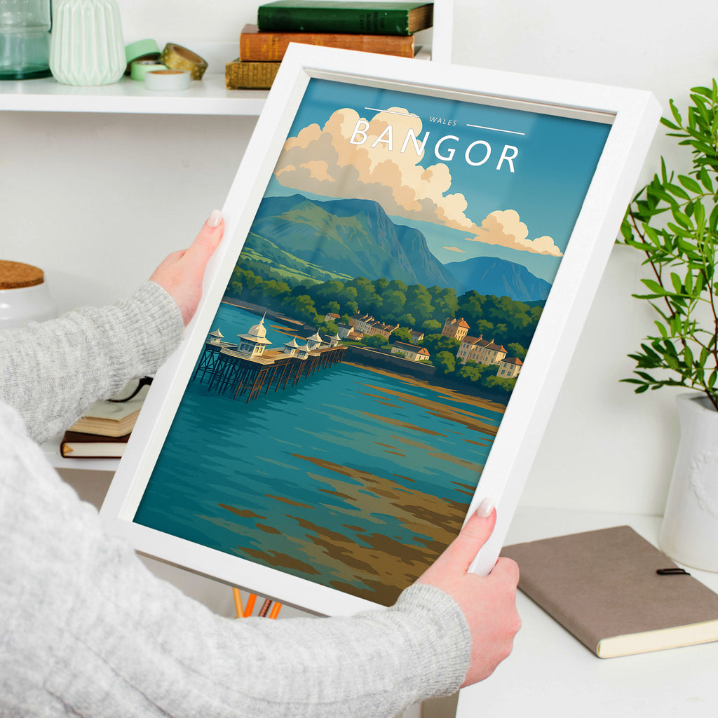 Bangor Travel Poster in a white frame, held to show scale
