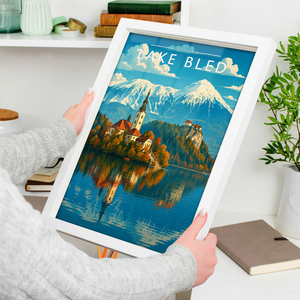 Lake Bled Travel Poster in a white frame, held to show scale