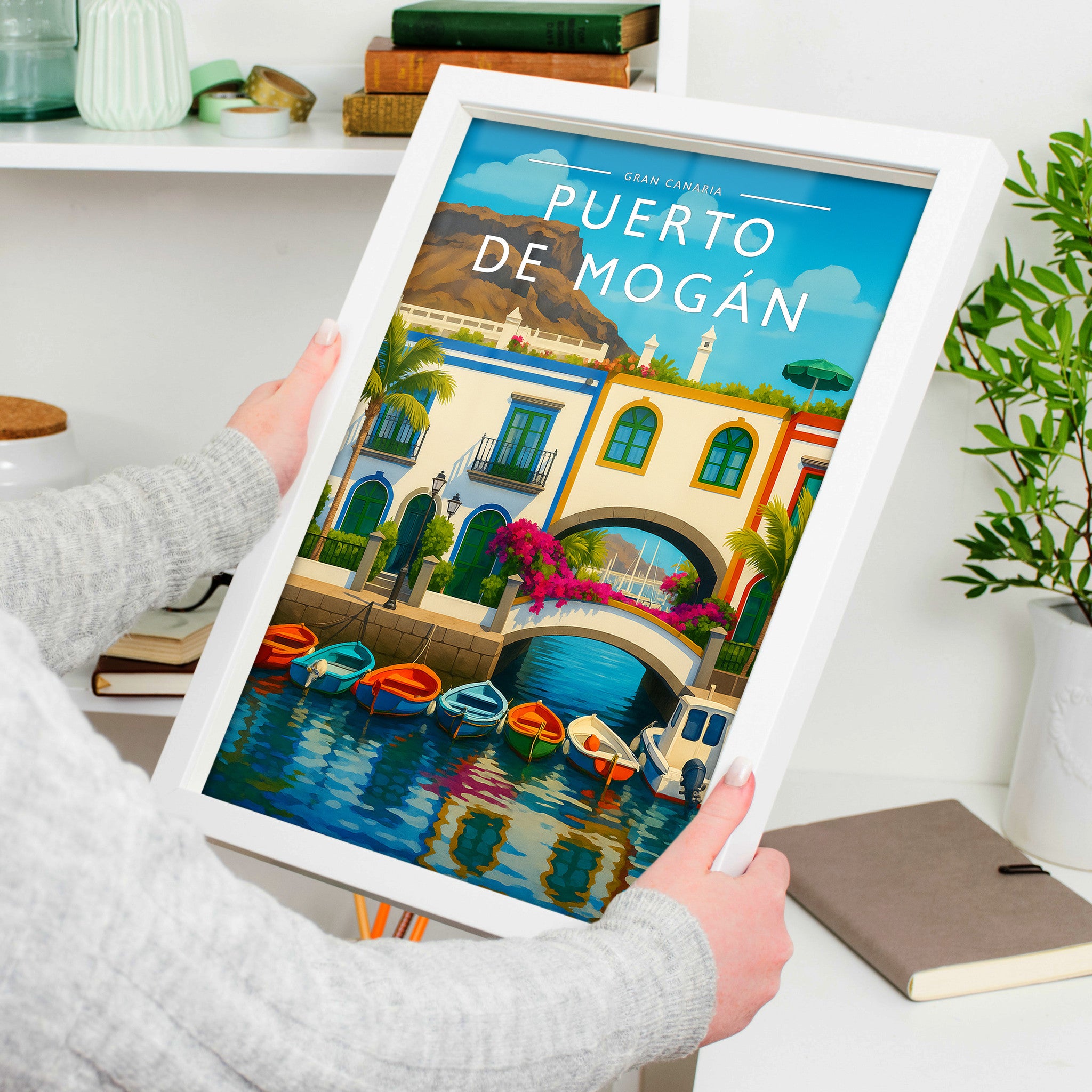 Puerto de Mogán #2 Travel Poster in a white frame, held to show scale