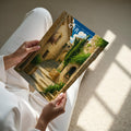 Girona Travel Poster - A4 print held in hand