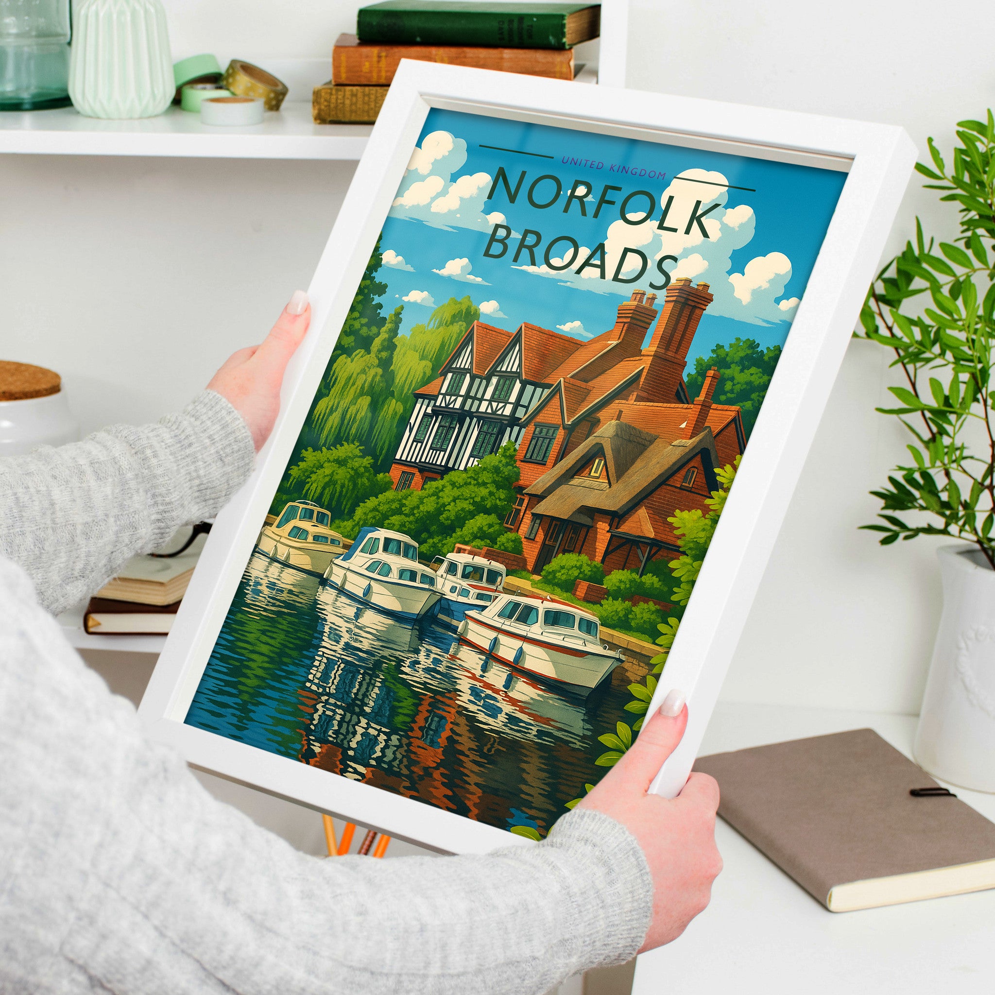 Norfolk Broads Travel Poster in a white frame, held to show scale