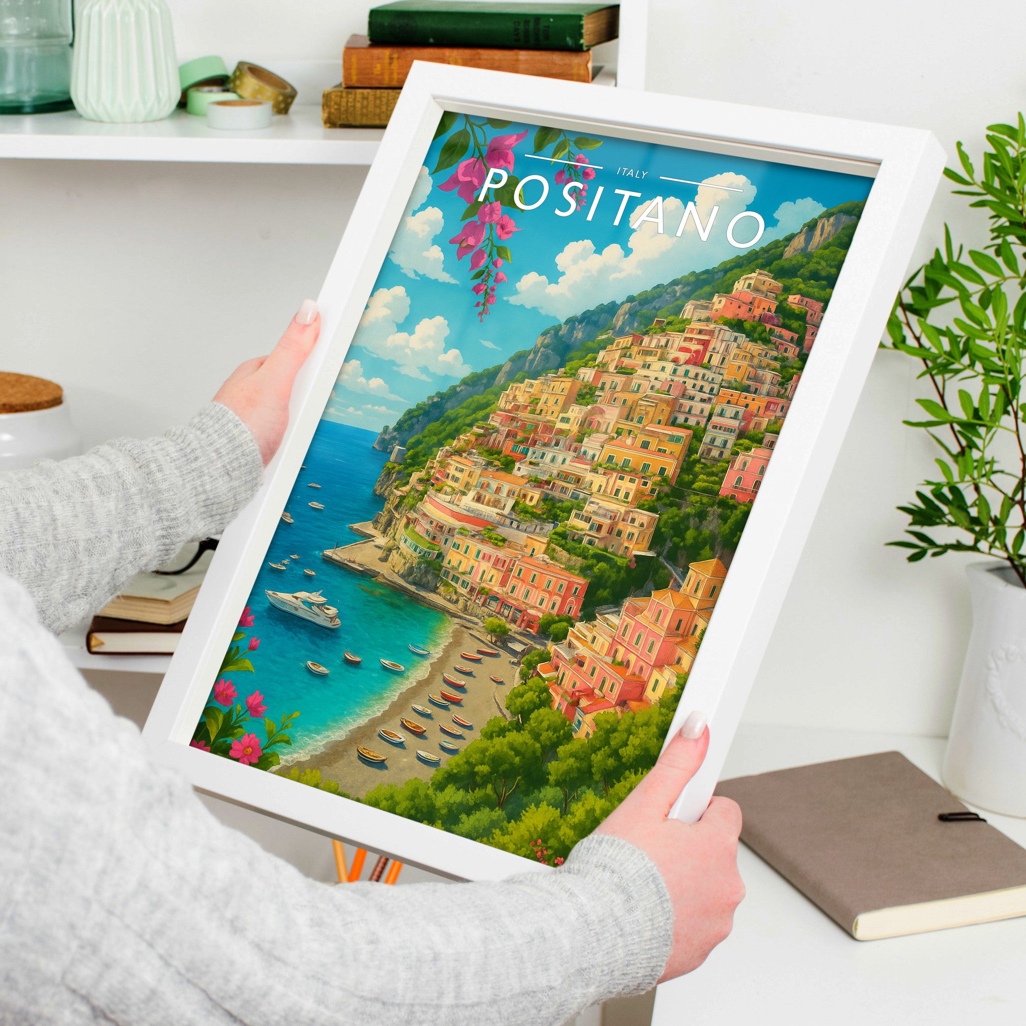 Positano #2 Travel Poster in a white frame, held to show scale