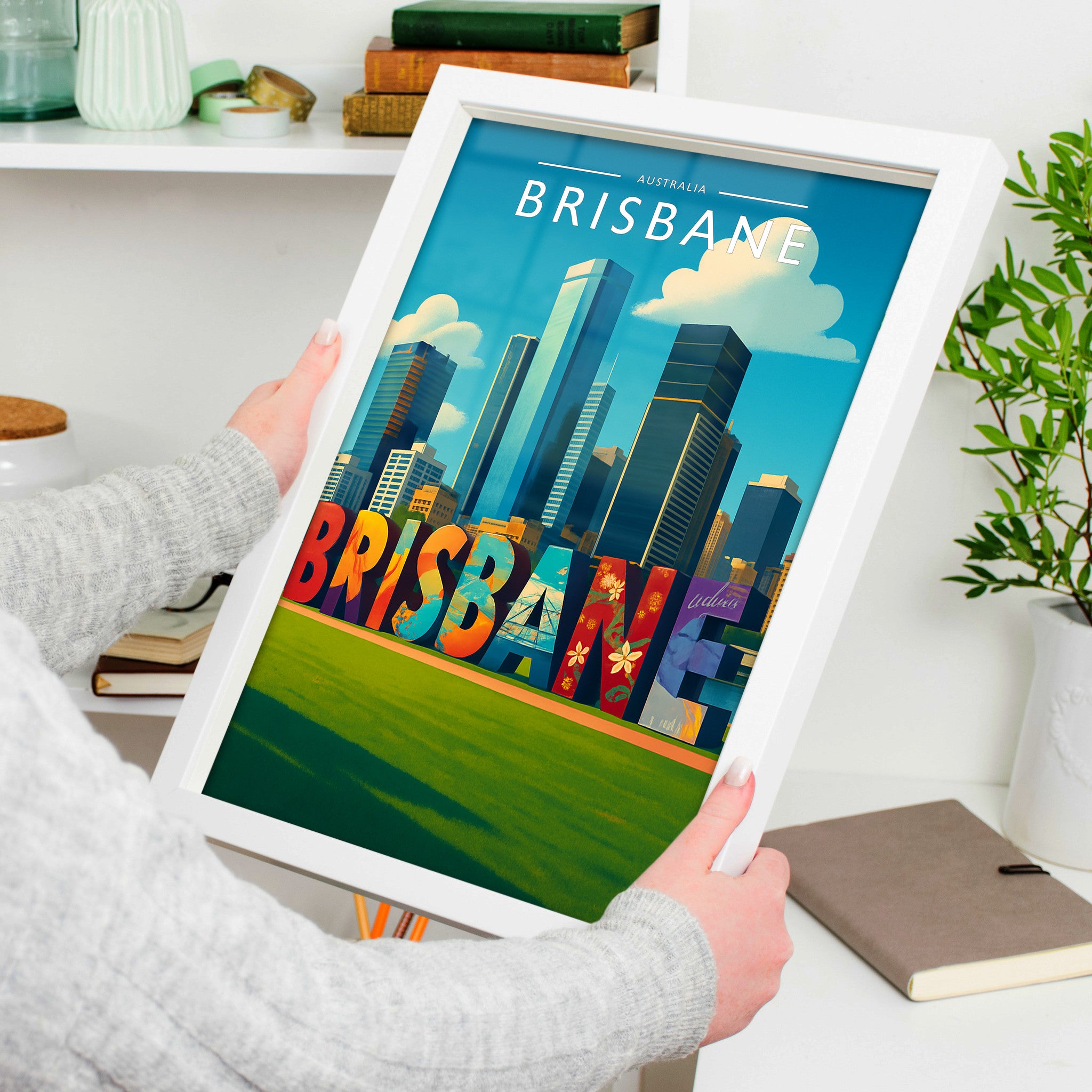 Brisbane #2 Travel Poster in a white frame, held to show scale