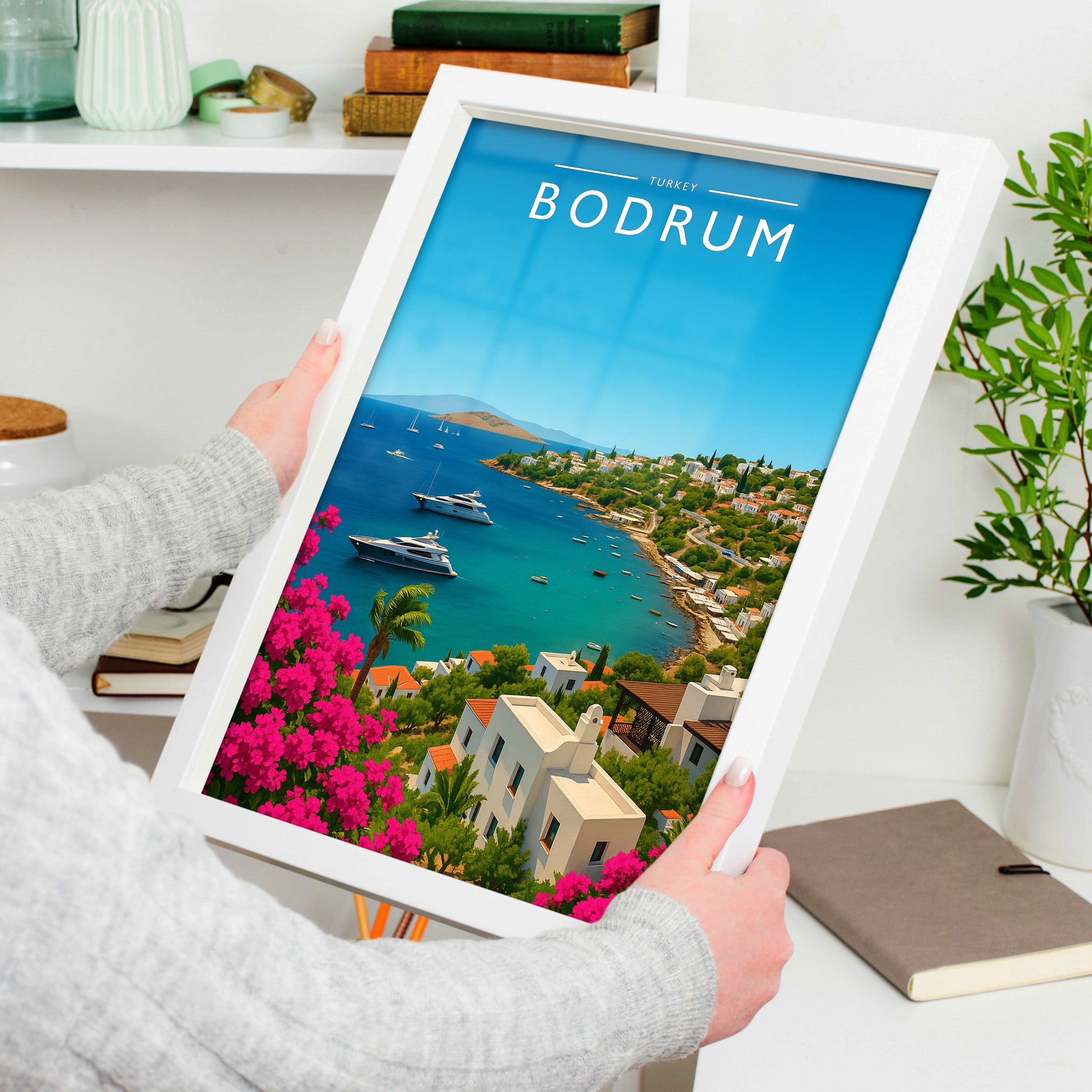 Bodrum Travel Poster in a white frame, held to show scale
