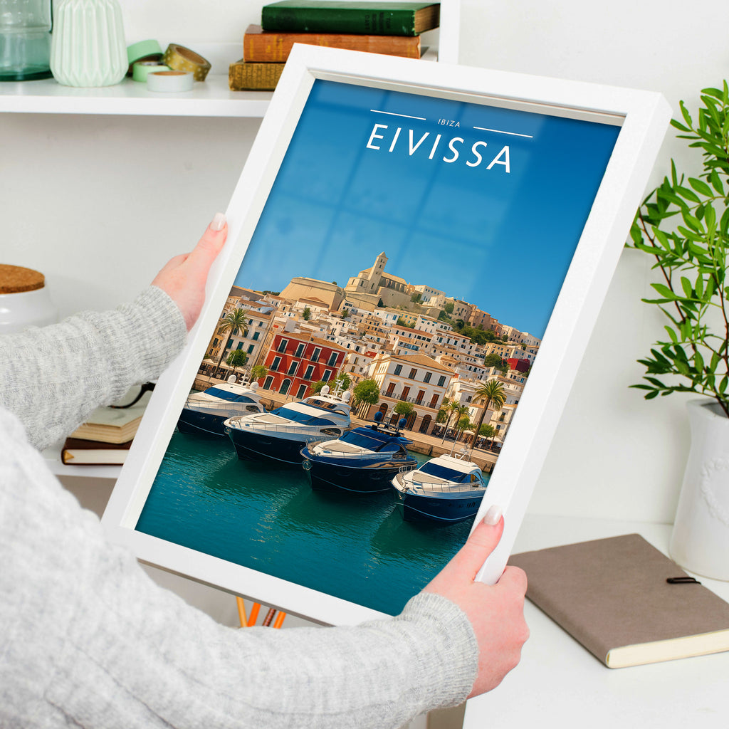 Eivissa Travel Poster in a white frame, held to show scale