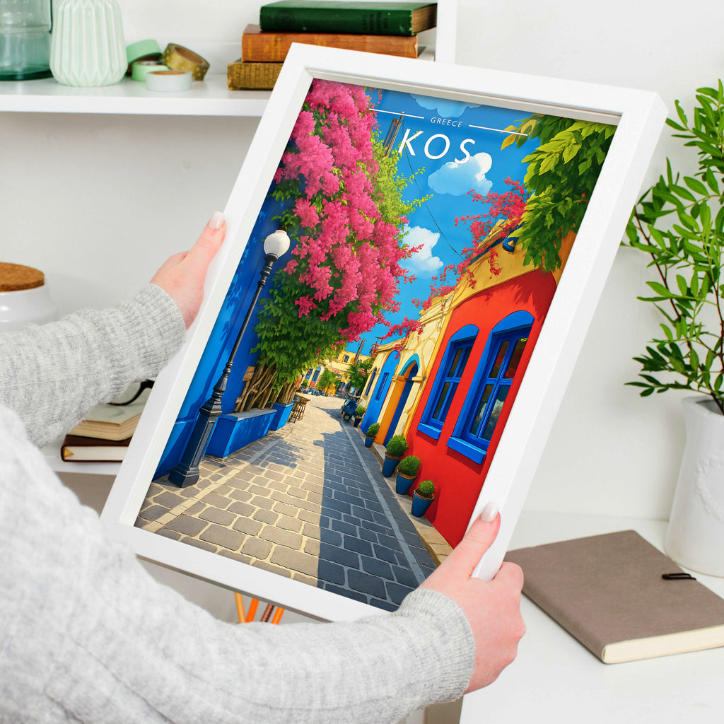 Kos Travel Poster in a white frame, held to show scale