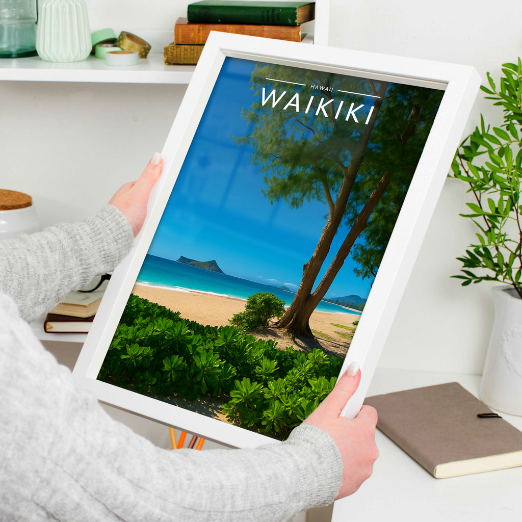 Waikiki Travel Poster in a white frame, held to show scale
