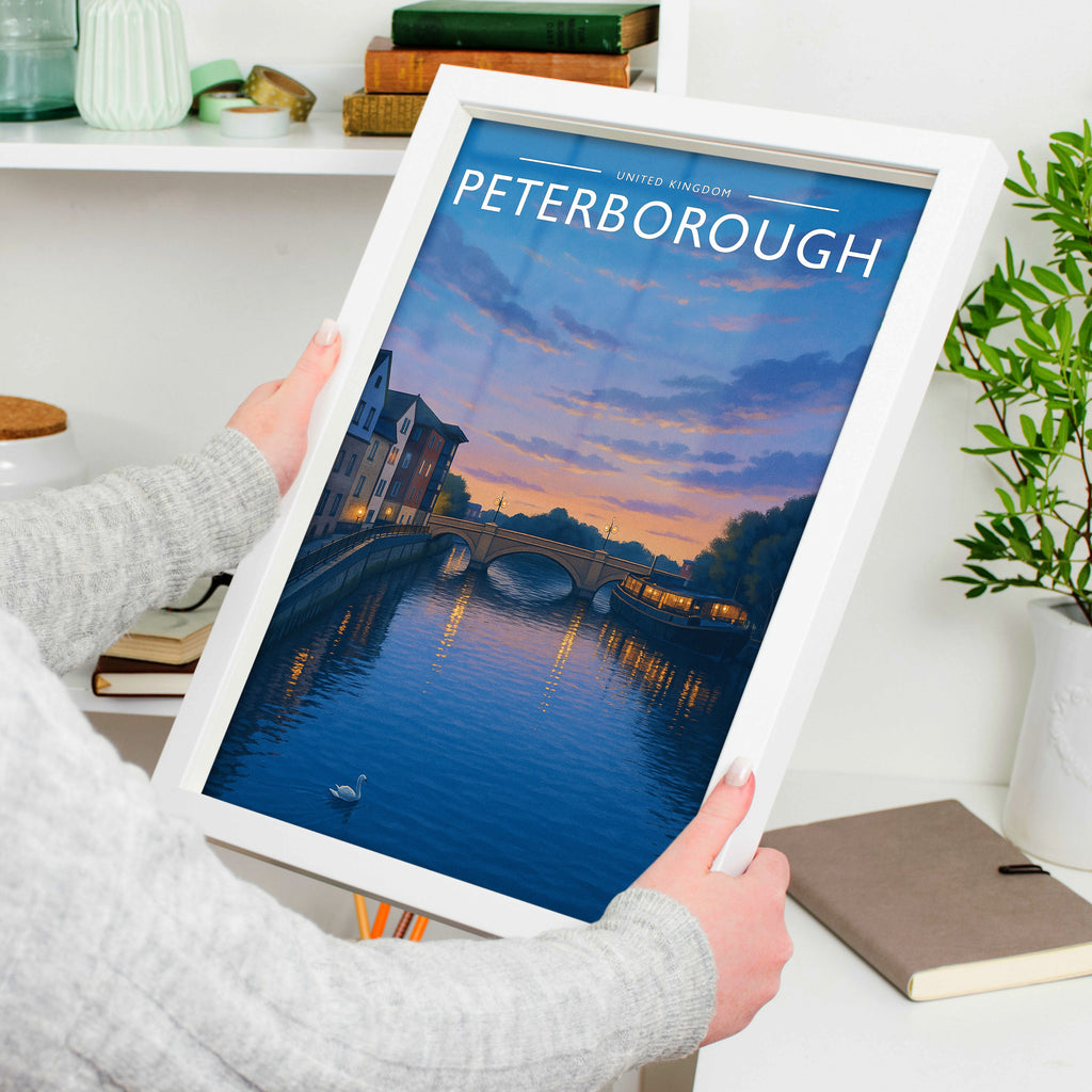 Peterborough #2 Travel Poster in a white frame, held to show scale