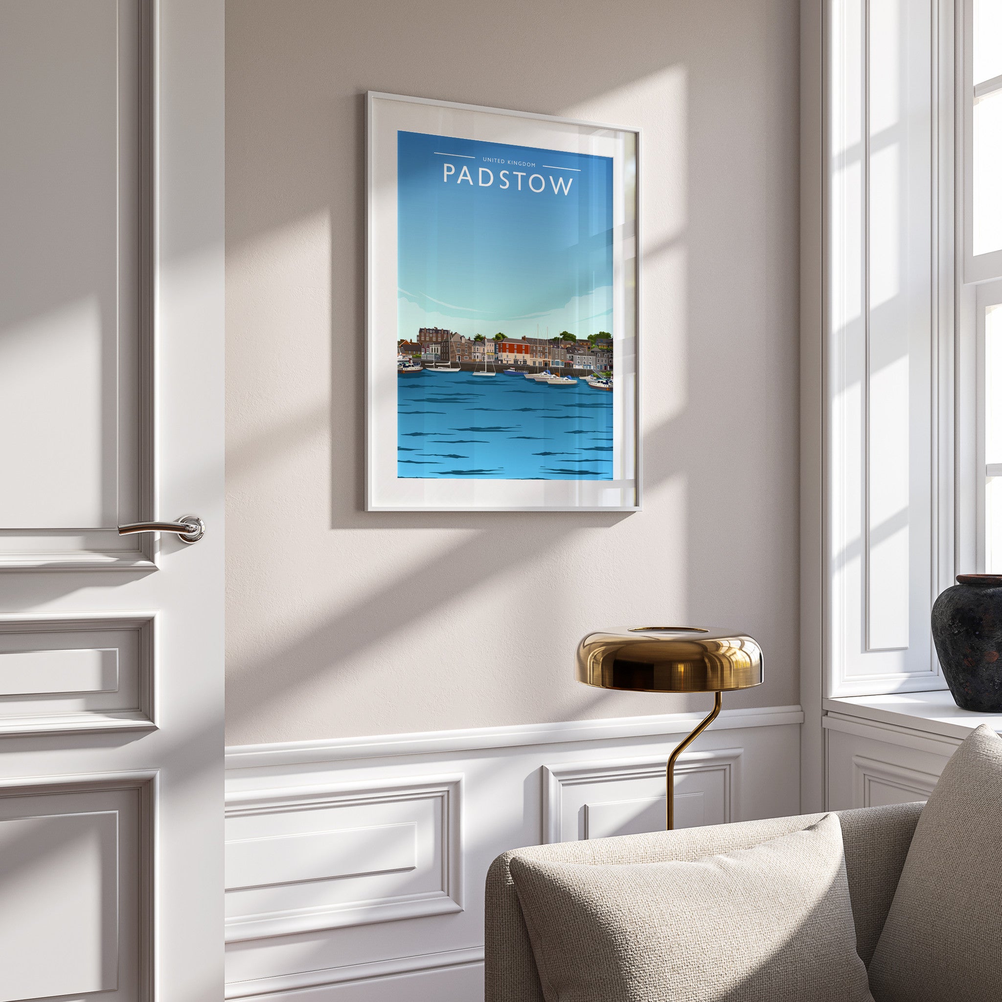 Padstow Travel Poster in a white frame on a panelled wall