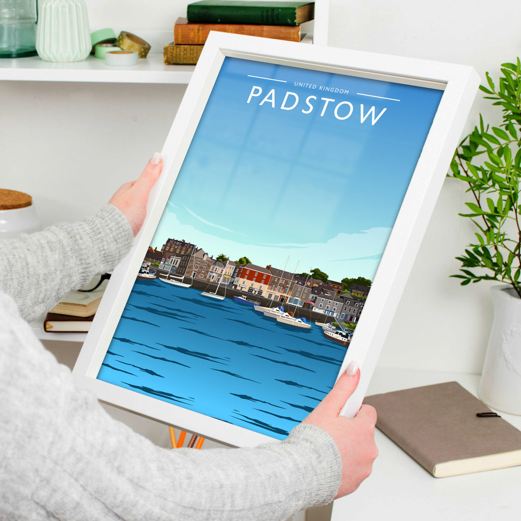 Padstow Travel Poster in a white frame, held to show scale