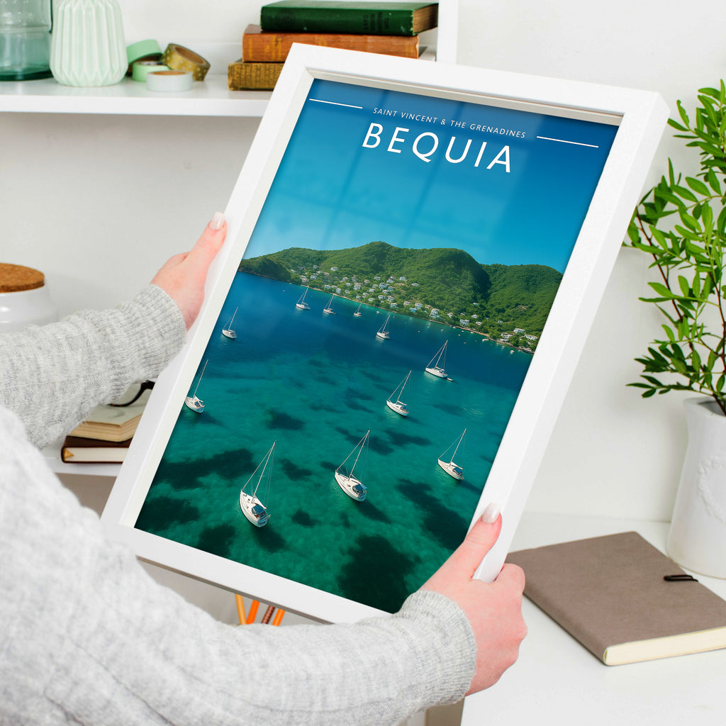 Bequia #2 Travel Poster in a white frame, held to show scale