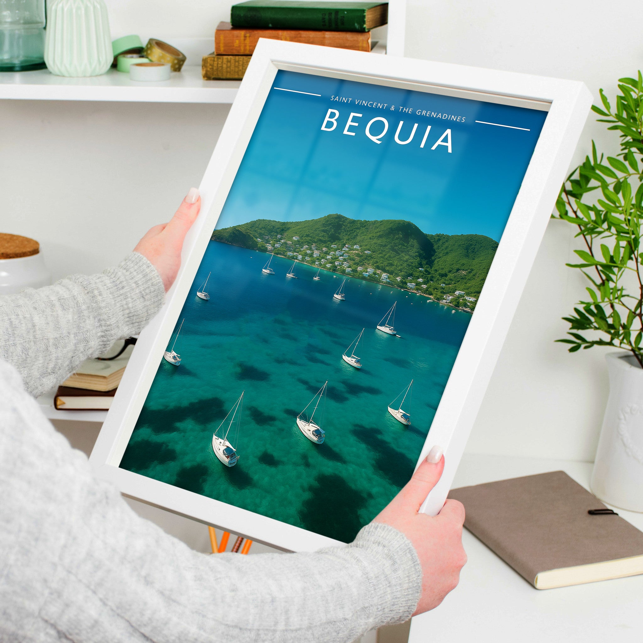 Bequia #2 Travel Poster in a white frame, held to show scale