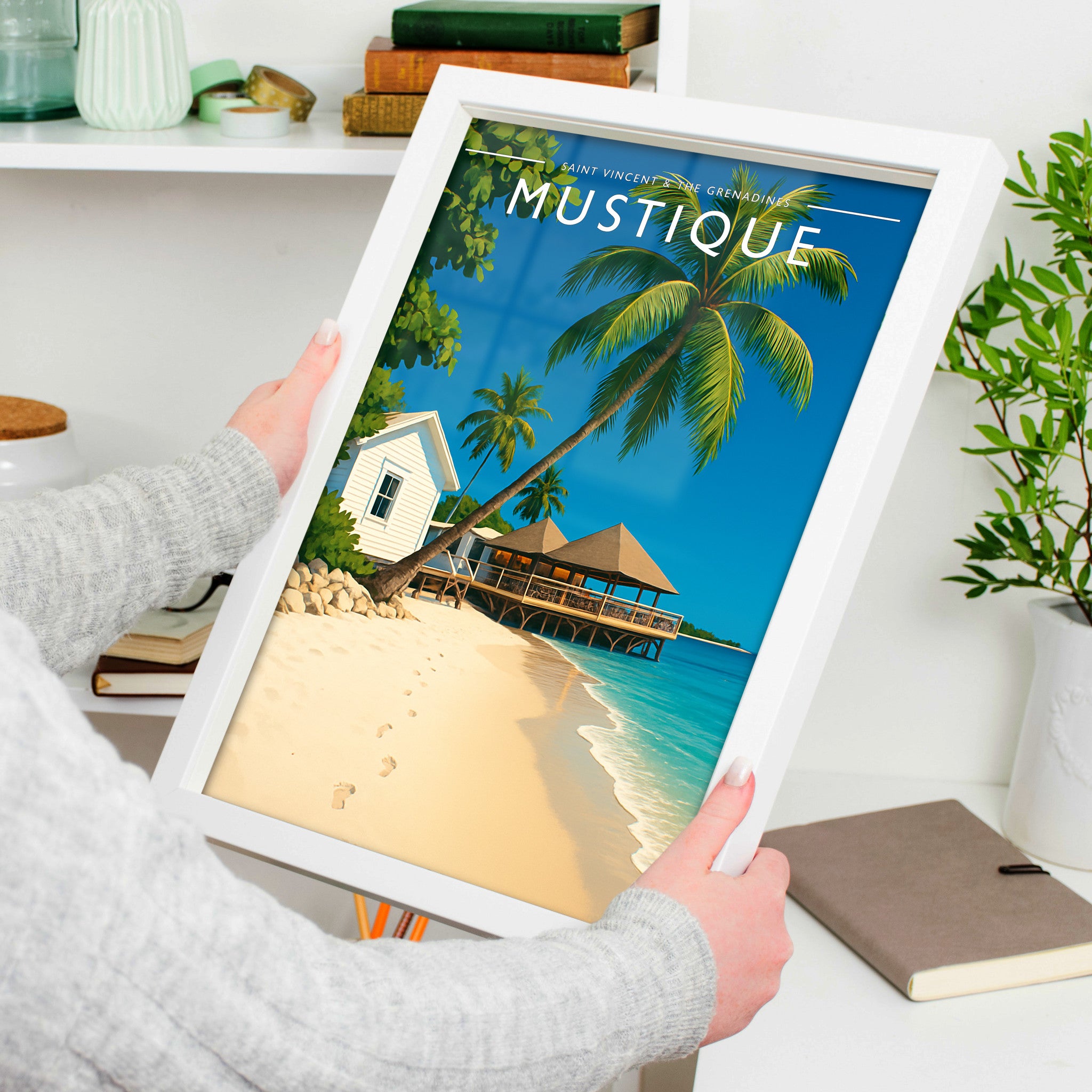 Mustique Travel Poster in a white frame, held to show scale