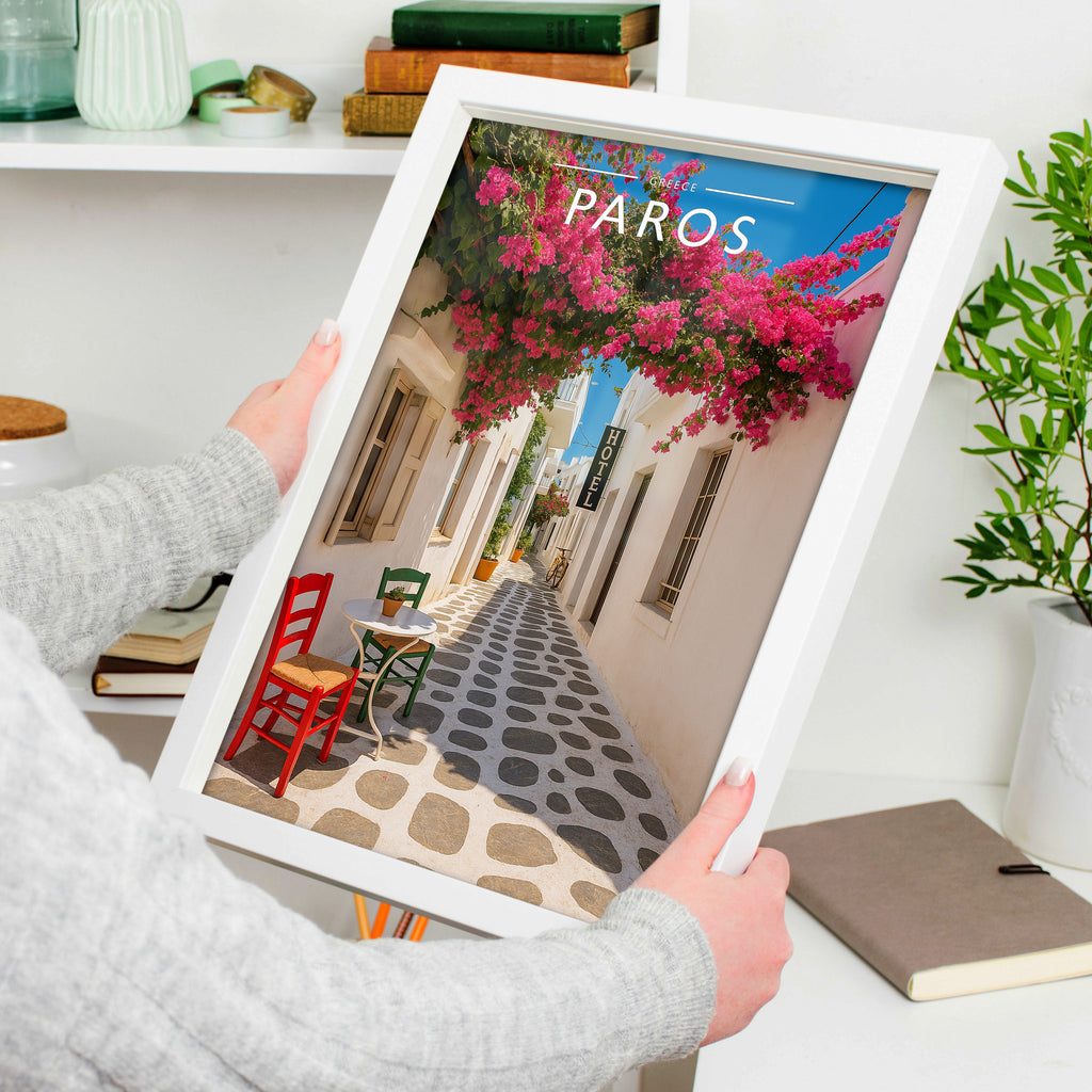 Paros Travel Poster in a white frame, held to show scale