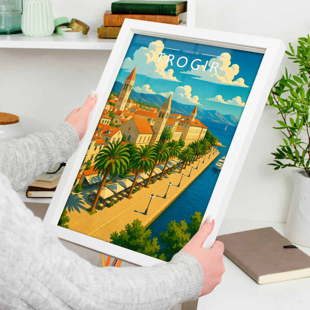 Trogir #2 Travel Poster in a white frame, held to show scale