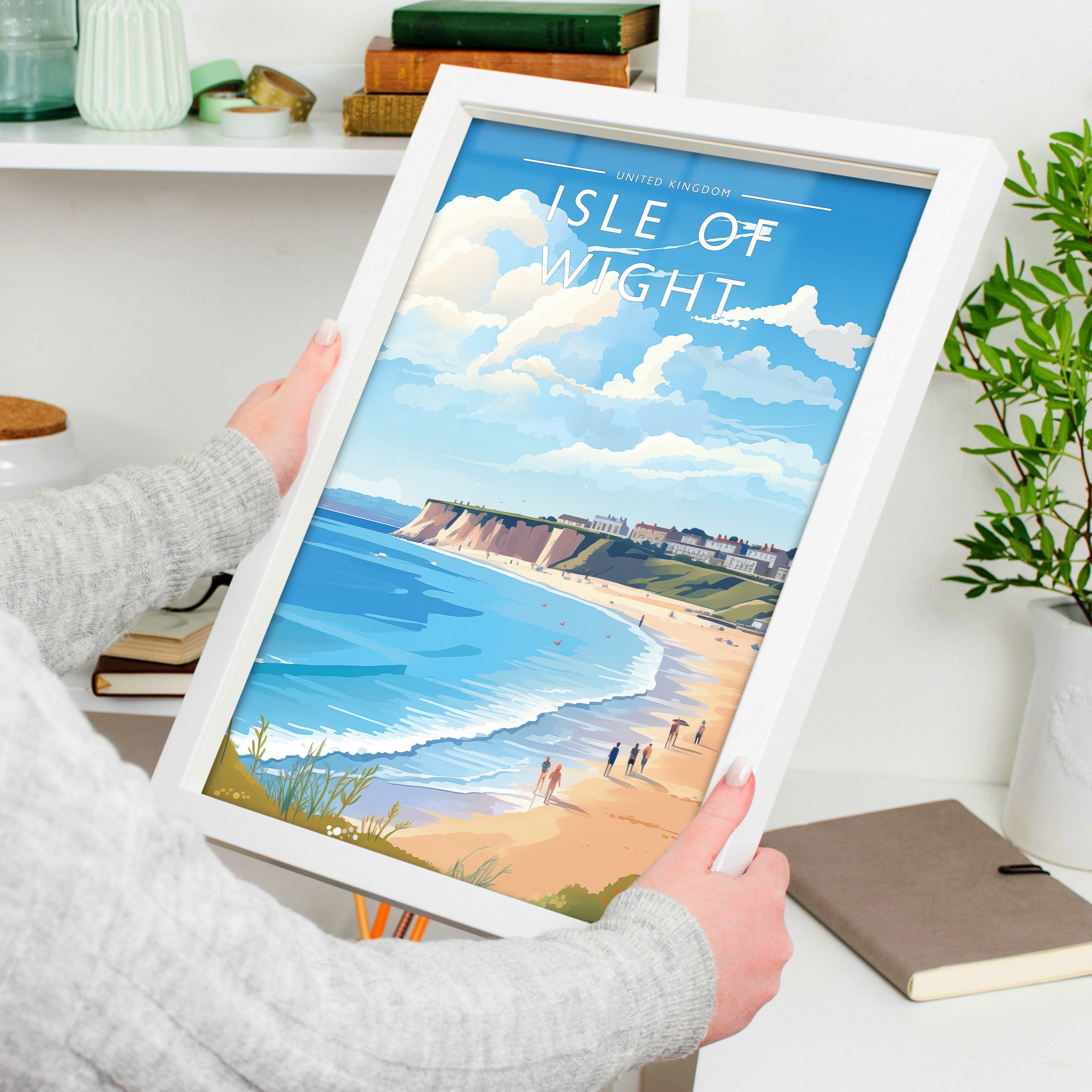 Isle of Wight Travel Poster in a white frame, held to show scale
