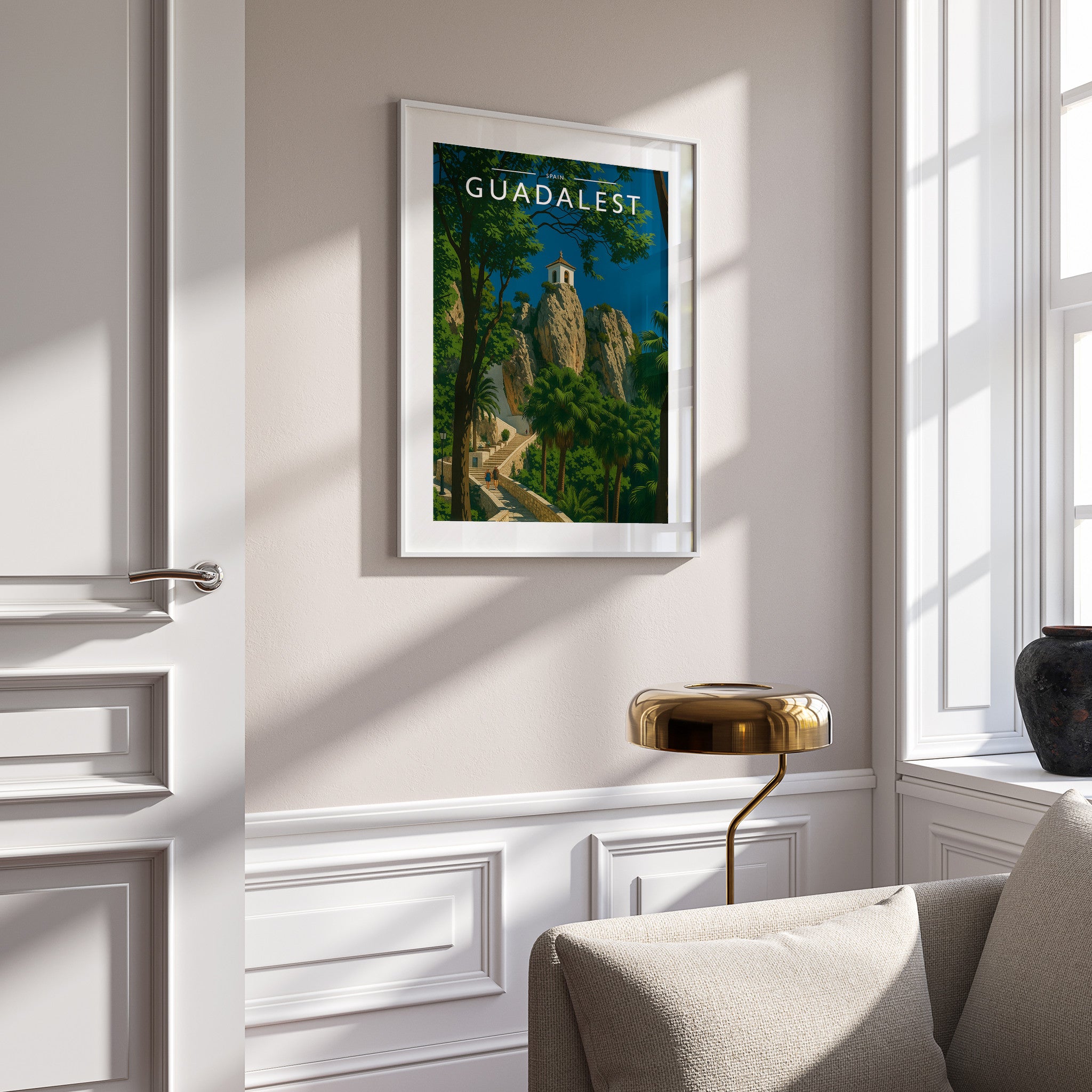 Guadalest Travel Poster in a white frame on a panelled wall