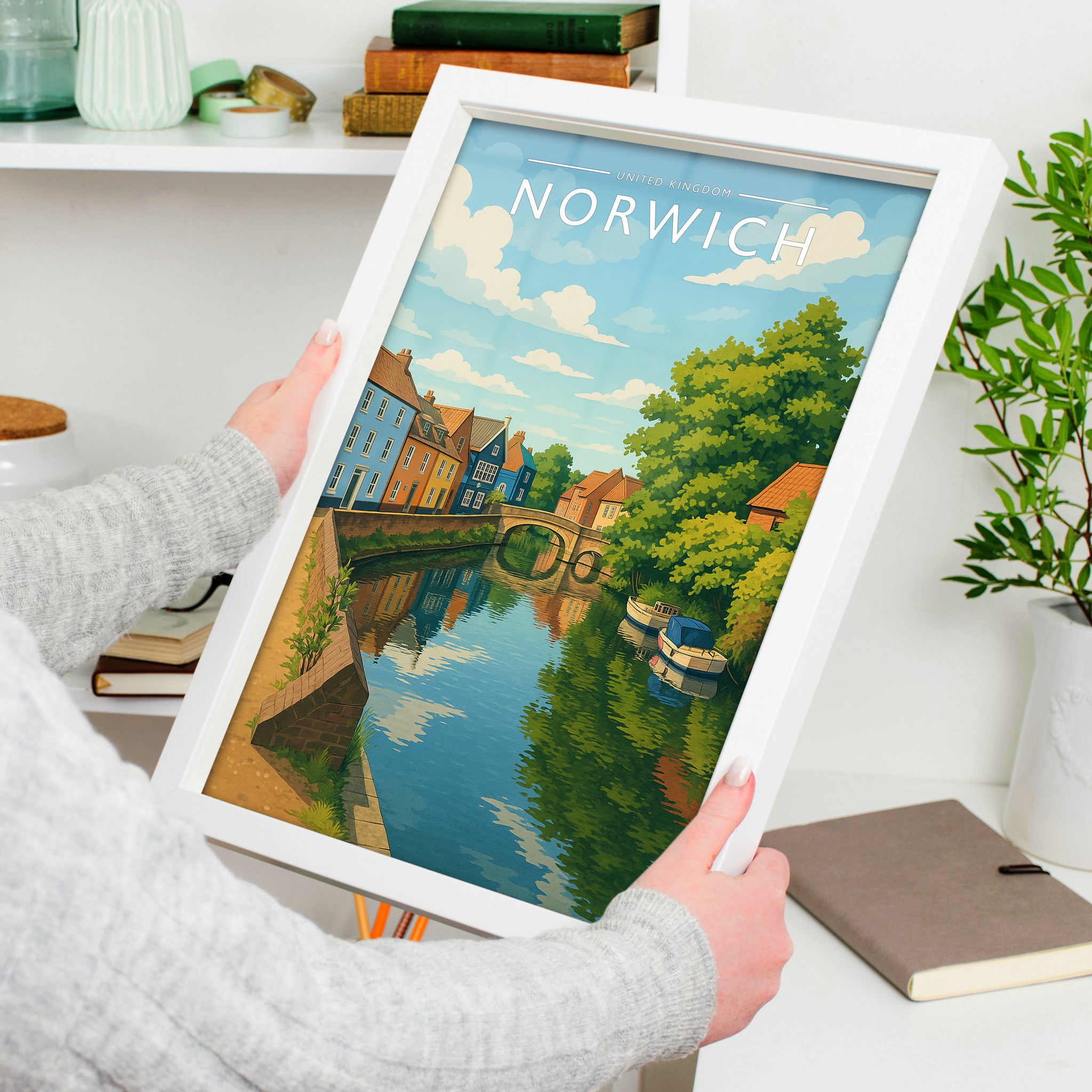 Norwich #2 Travel Poster in a white frame, held to show scale