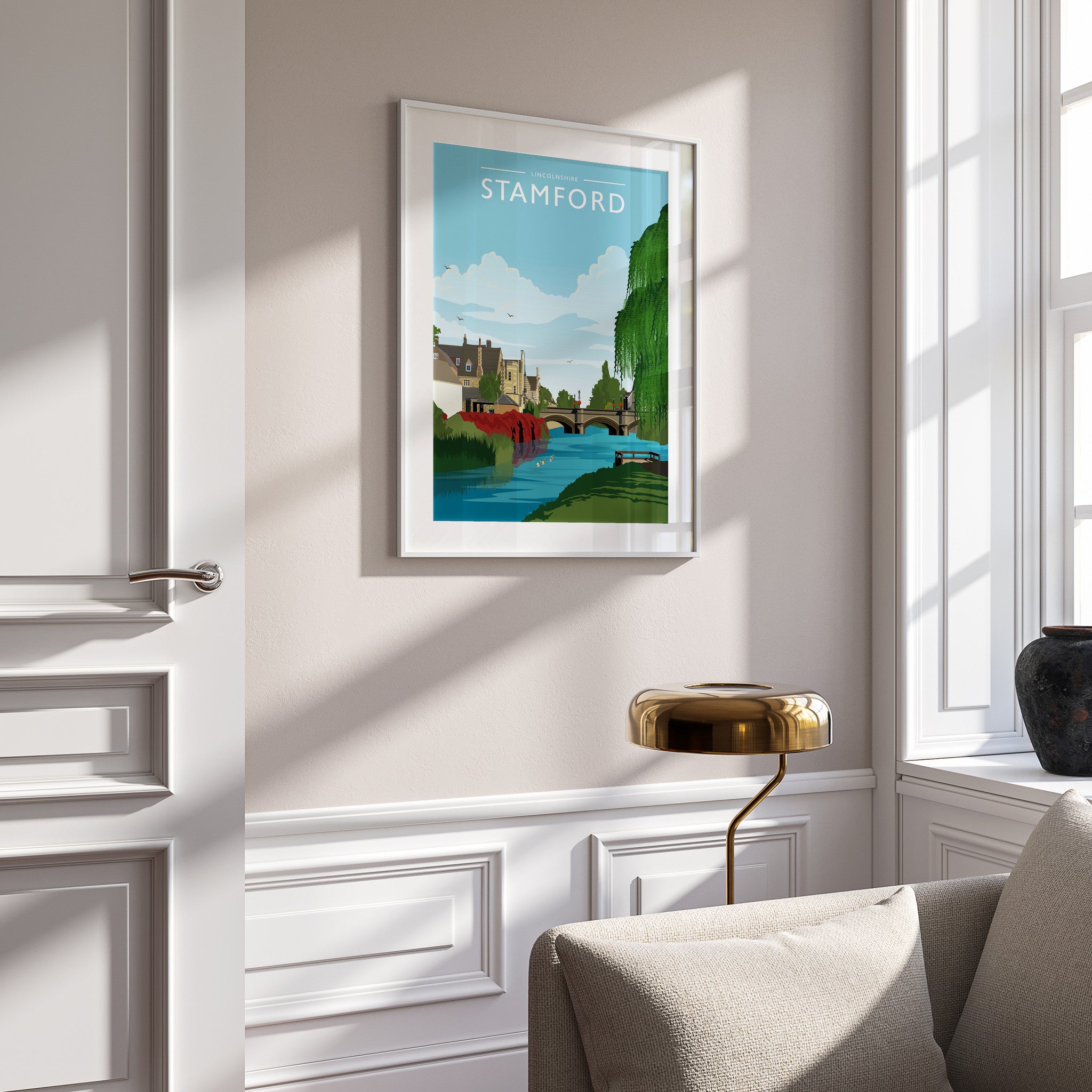 Stamford Travel Poster in a white frame on a panelled wall