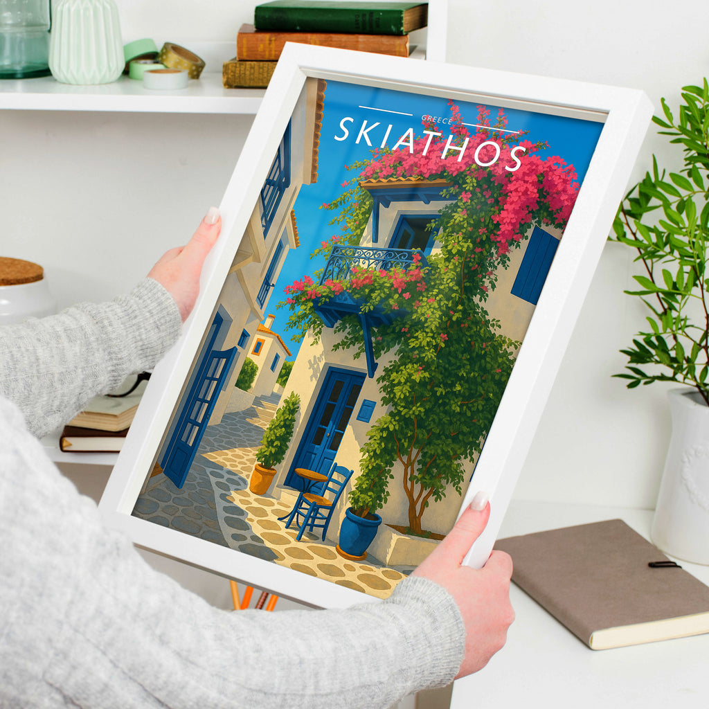 Skiathos Travel Poster in a white frame, held to show scale
