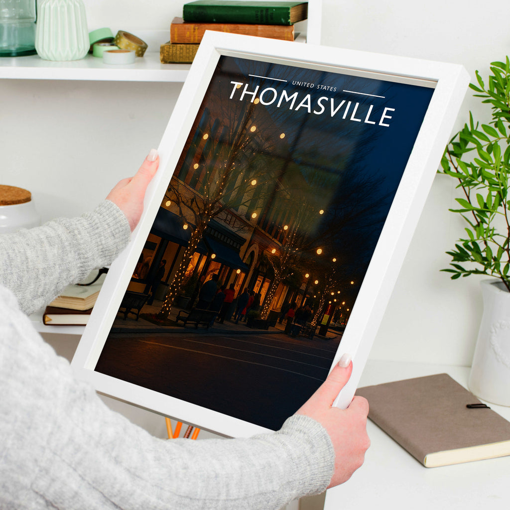 Thomasville #2 Travel Poster in a white frame, held to show scale