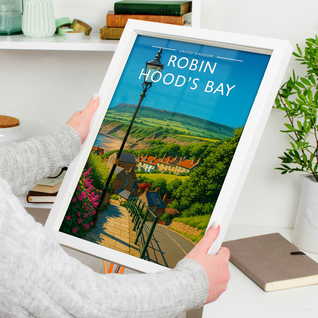 Robin Hood’s Bay #2 Travel Poster in a white frame, held to show scale