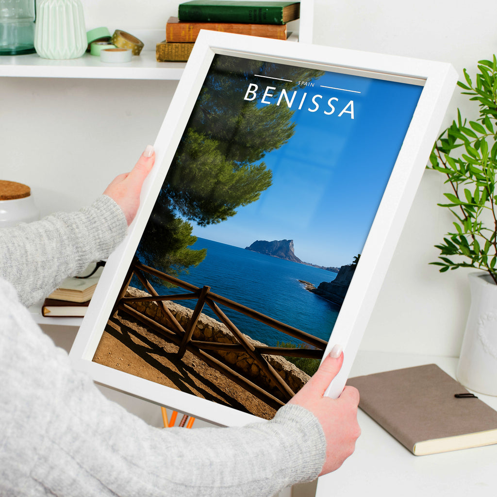 Benissa Travel Poster in a white frame, held to show scale
