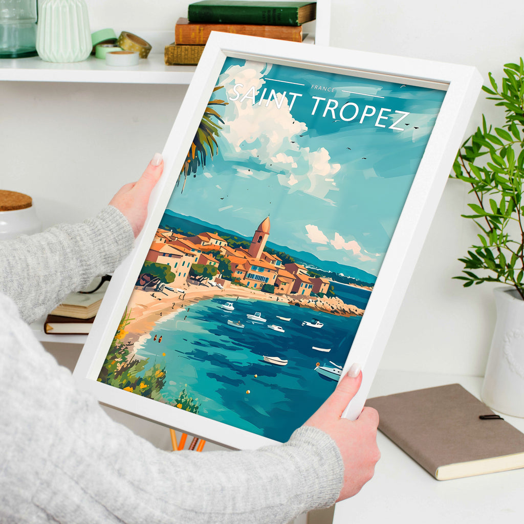 Saint Tropez Travel Poster in a white frame, held to show scale