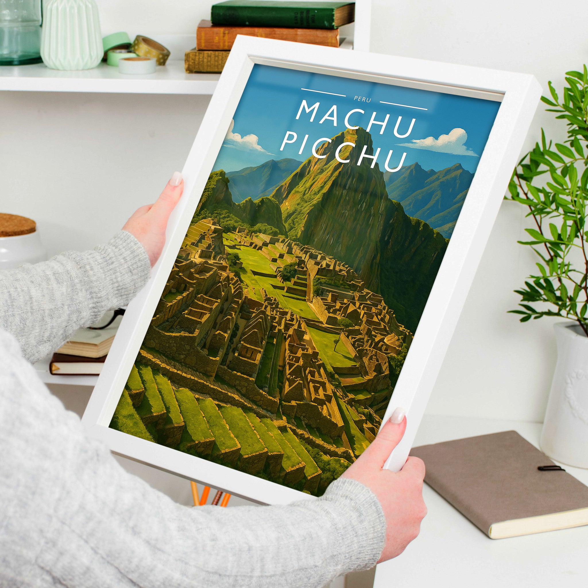 Machu Picchu Travel Poster in a white frame, held to show scale