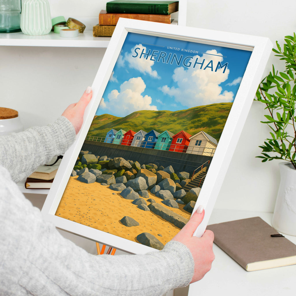 Sheringham Travel Poster in a white frame, held to show scale