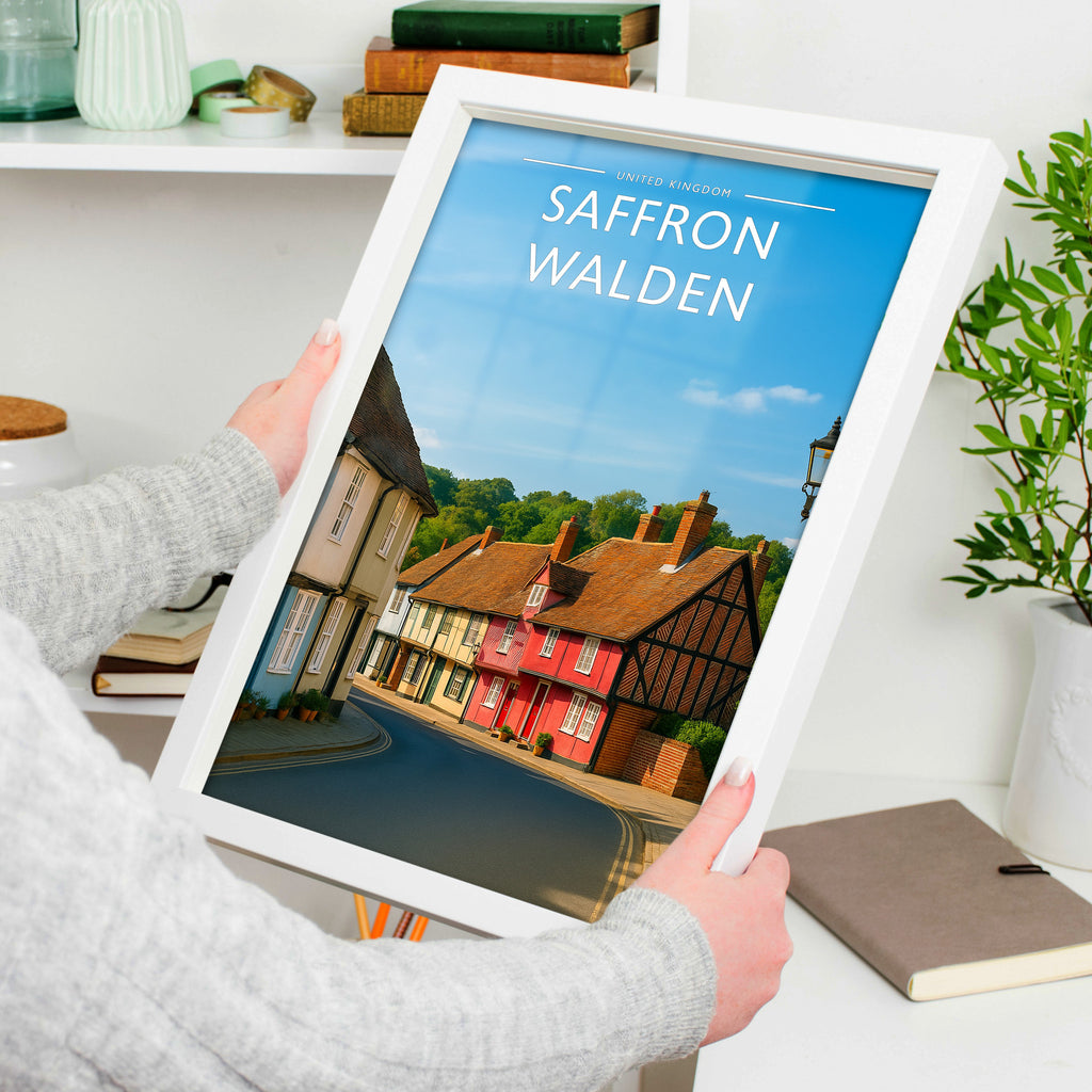 Saffron Walden #3 Travel Poster in a white frame, held to show scale