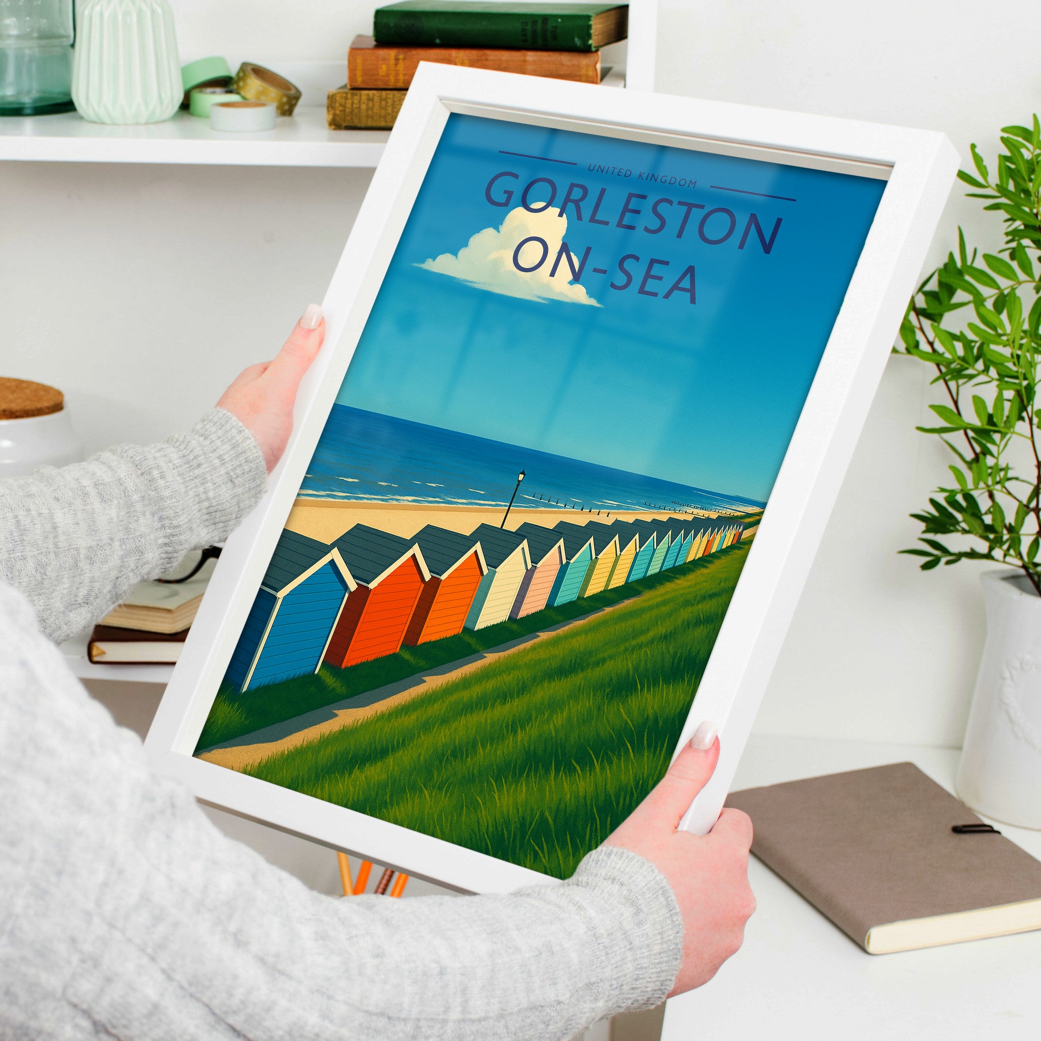 Gorleston-on-Sea Travel Poster in a white frame, held to show scale