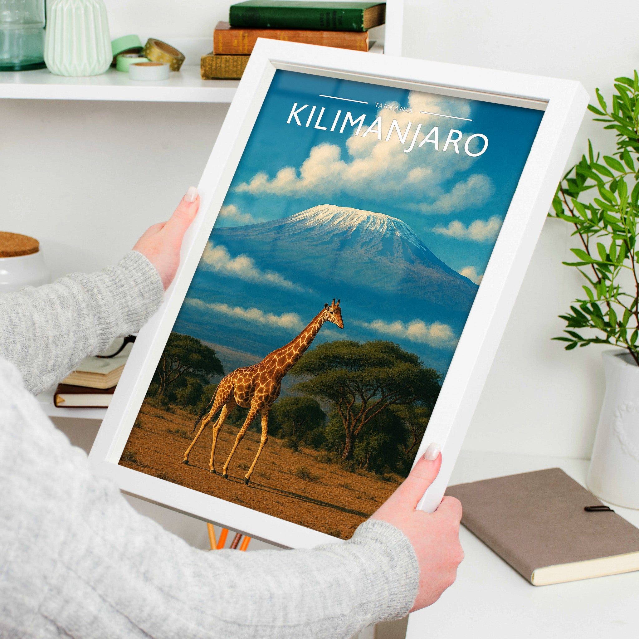 Kilimanjaro Travel Poster in a white frame, held to show scale
