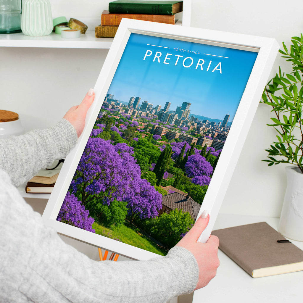 Pretoria Travel Poster in a white frame, held to show scale