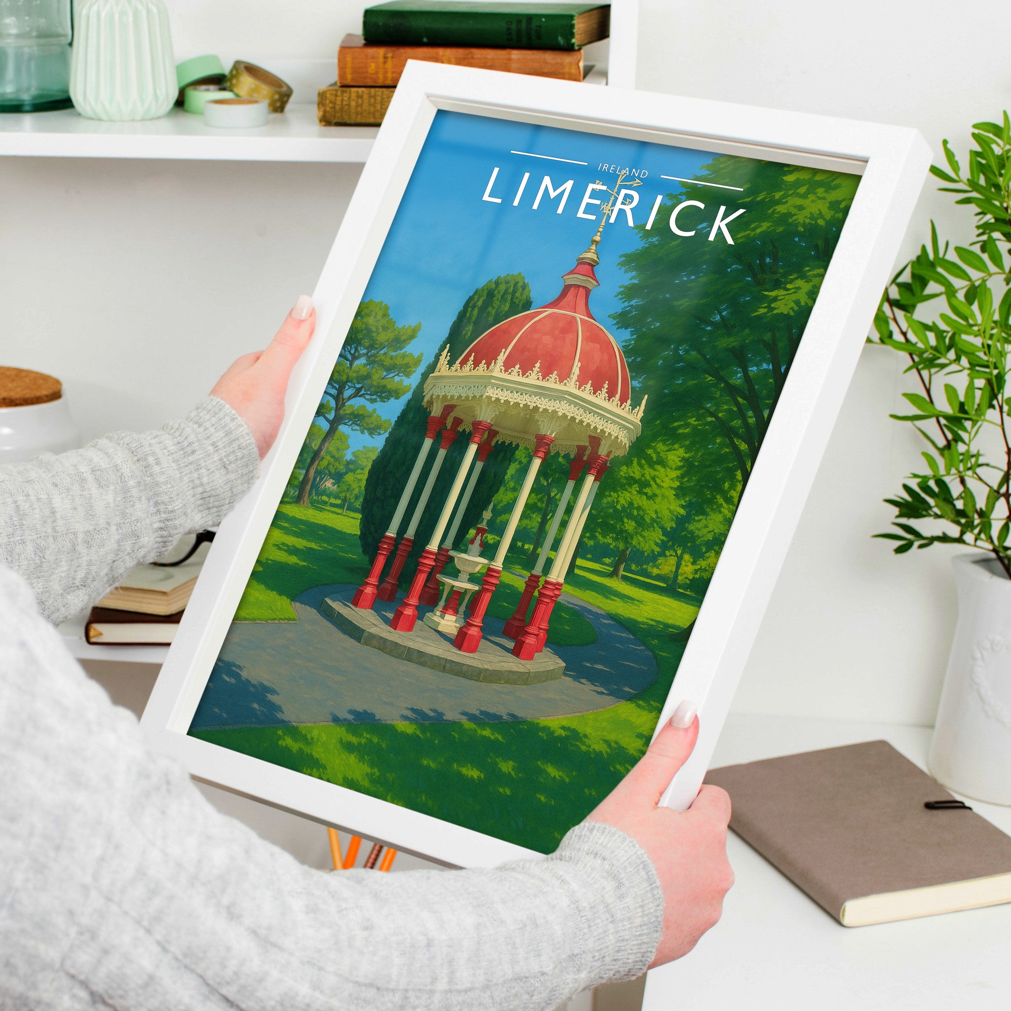 Limerick #2 Travel Poster in a white frame, held to show scale