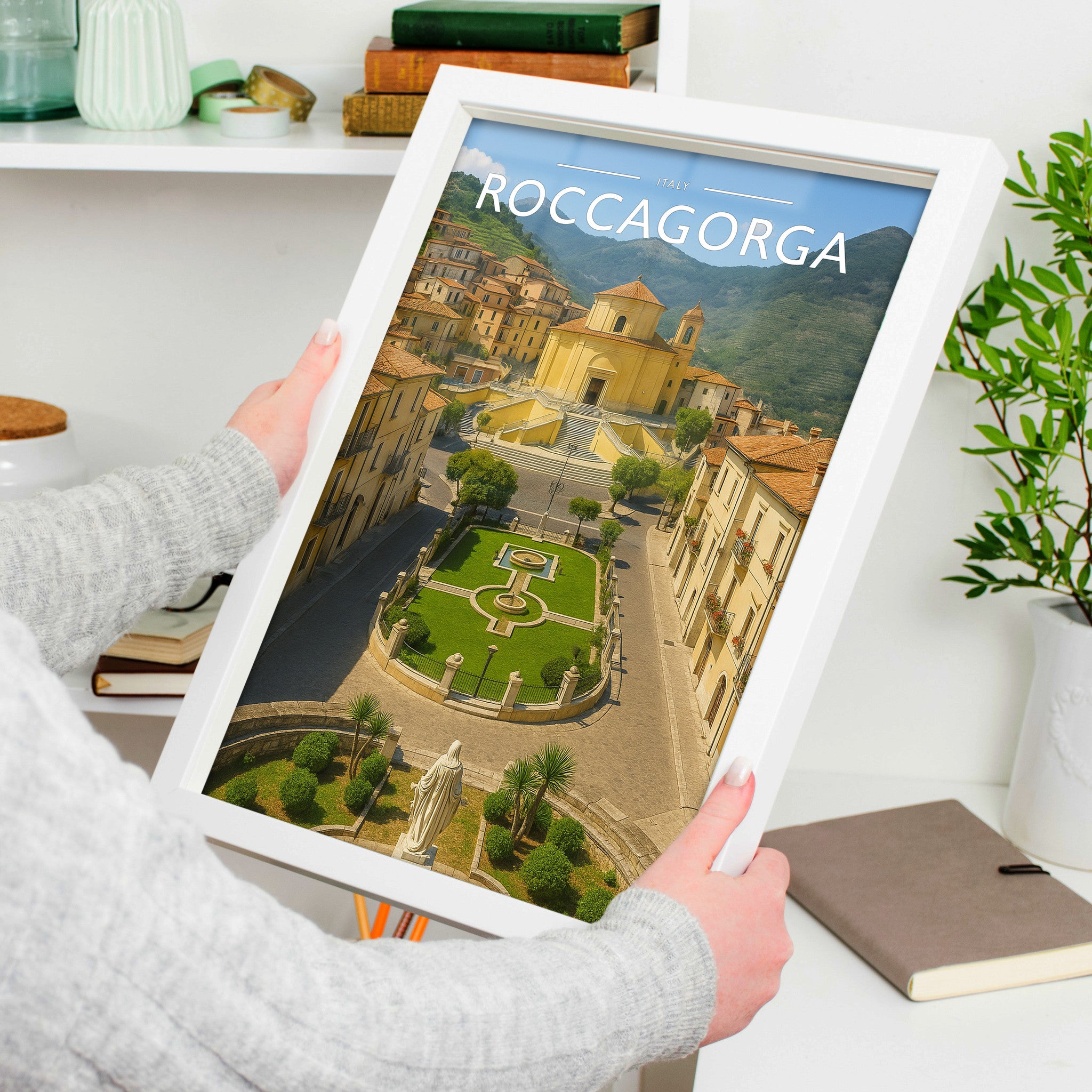 Roccagorga Travel Poster in a white frame, held to show scale