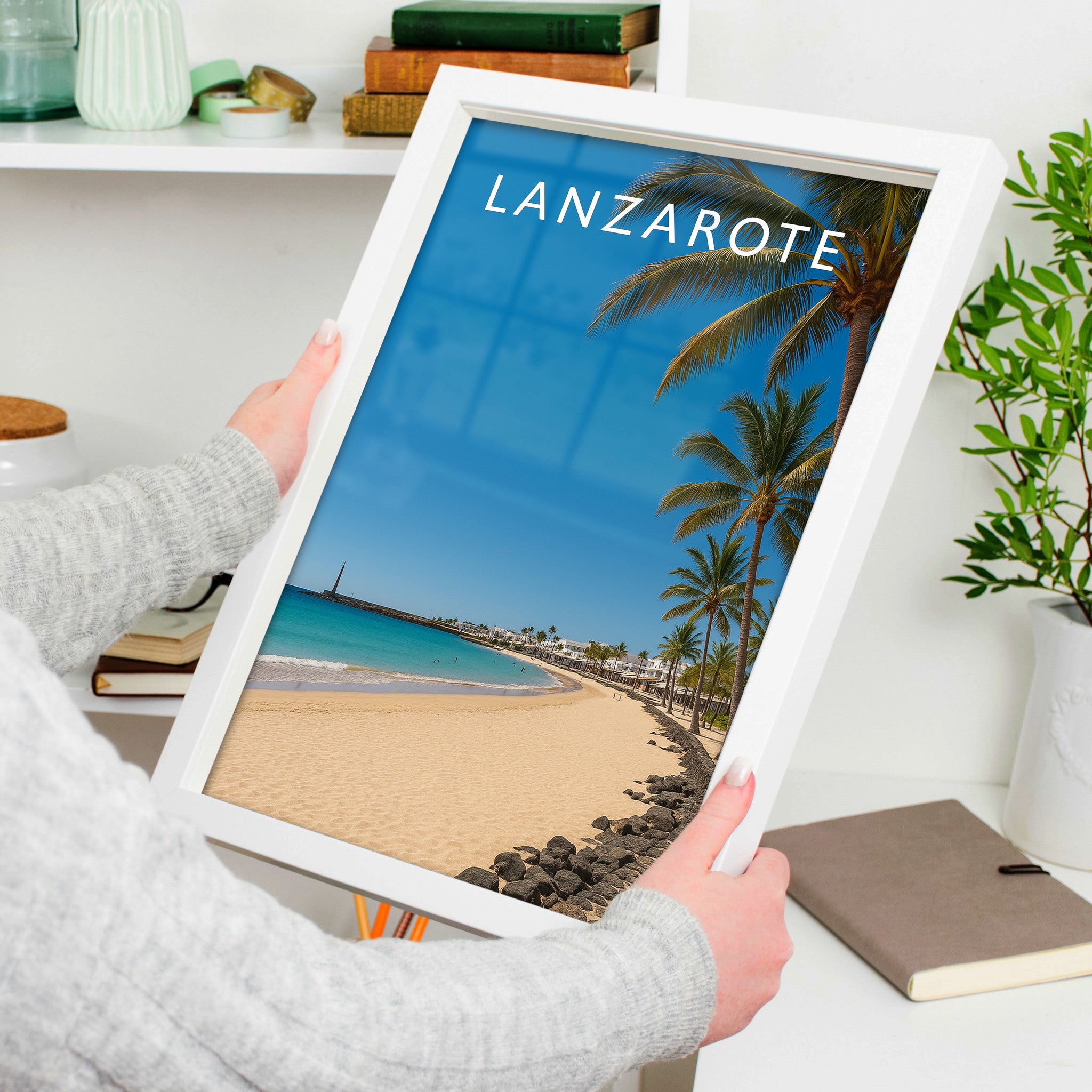 Lanzarote Travel Poster in a white frame, held to show scale