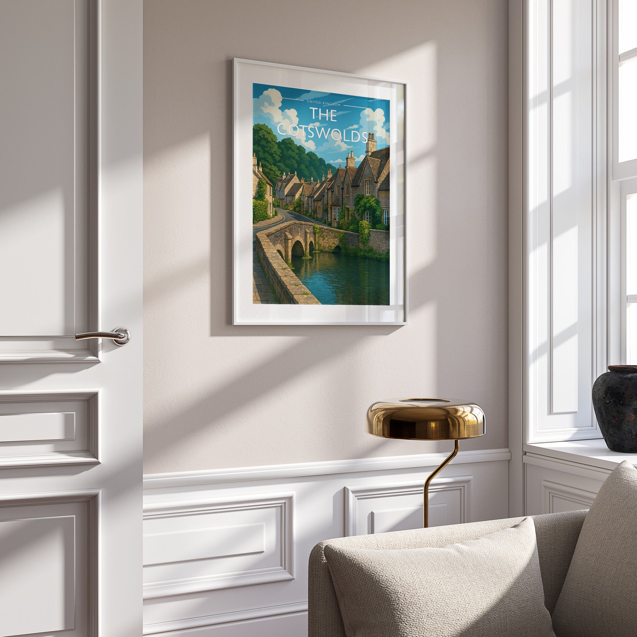 The Cotswolds Travel Poster in a white frame on a panelled wall