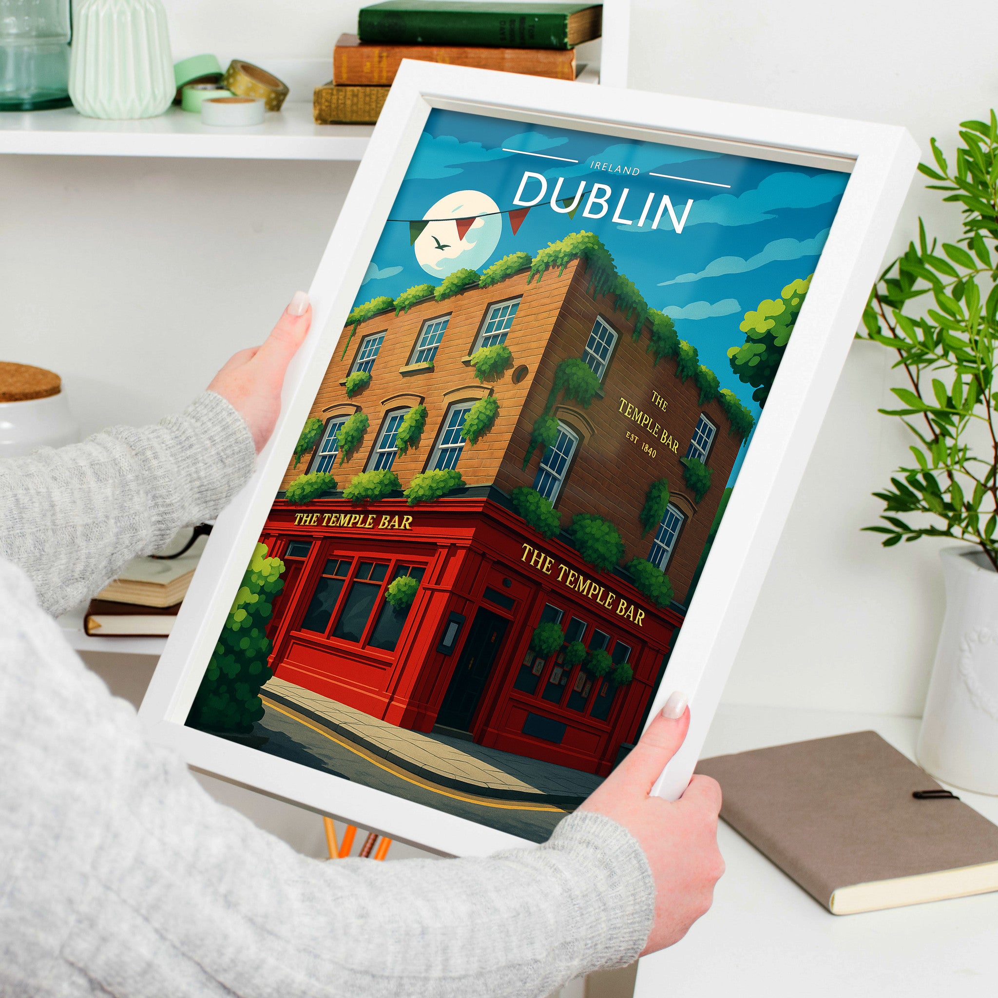 Dublin #2 Travel Poster in a white frame, held to show scale